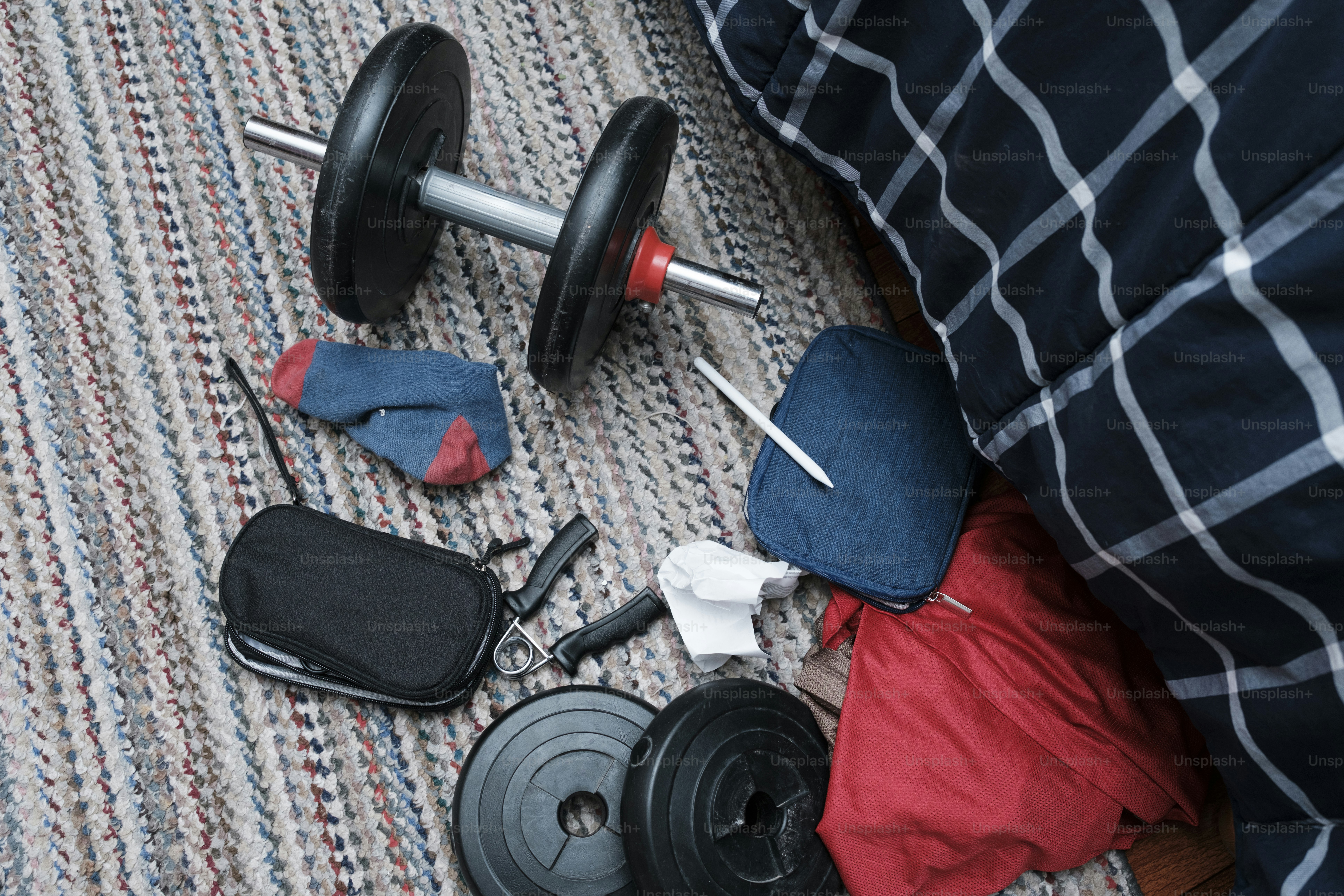Dumbbell and some scattered gym equipment.