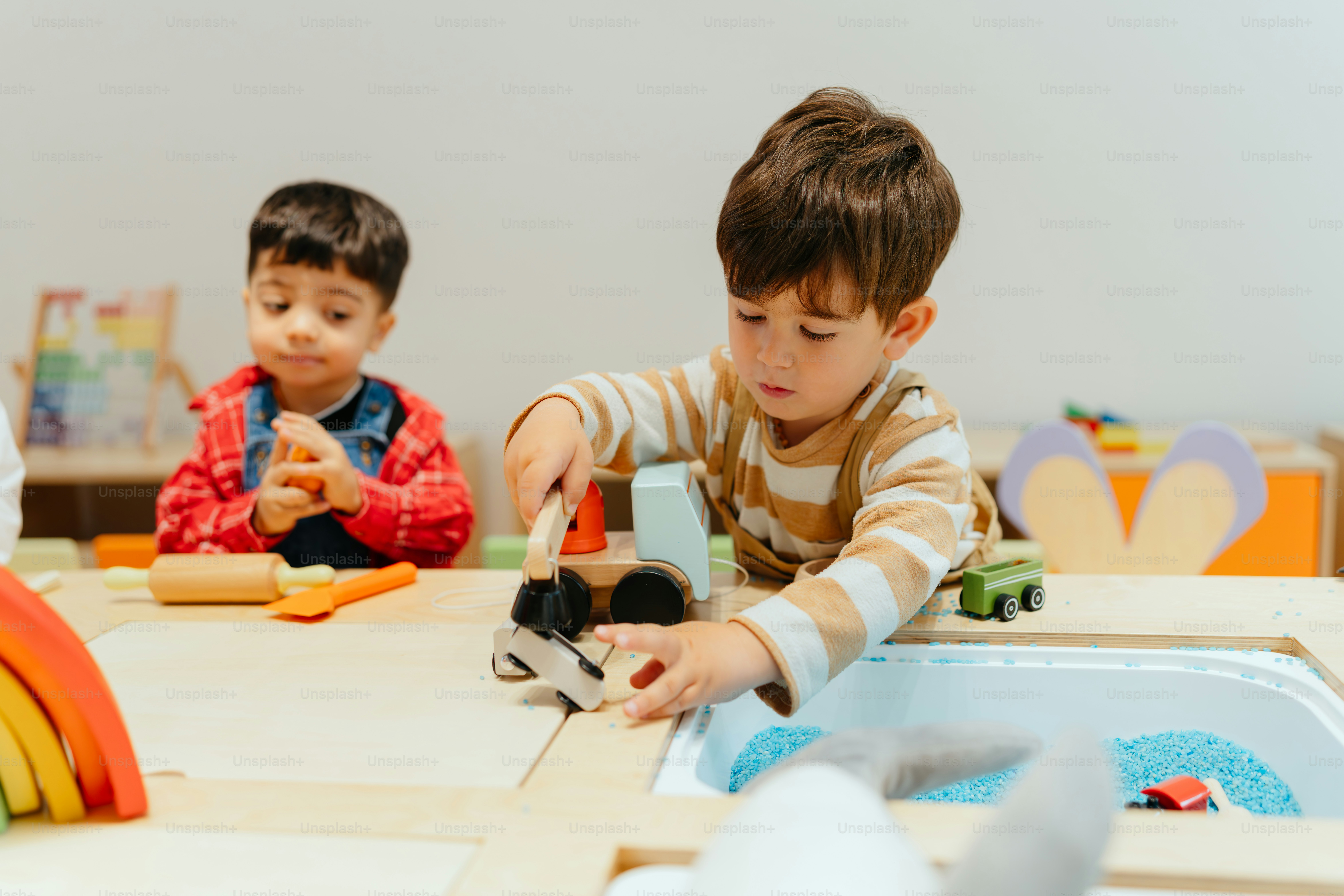 Two children playing at a table