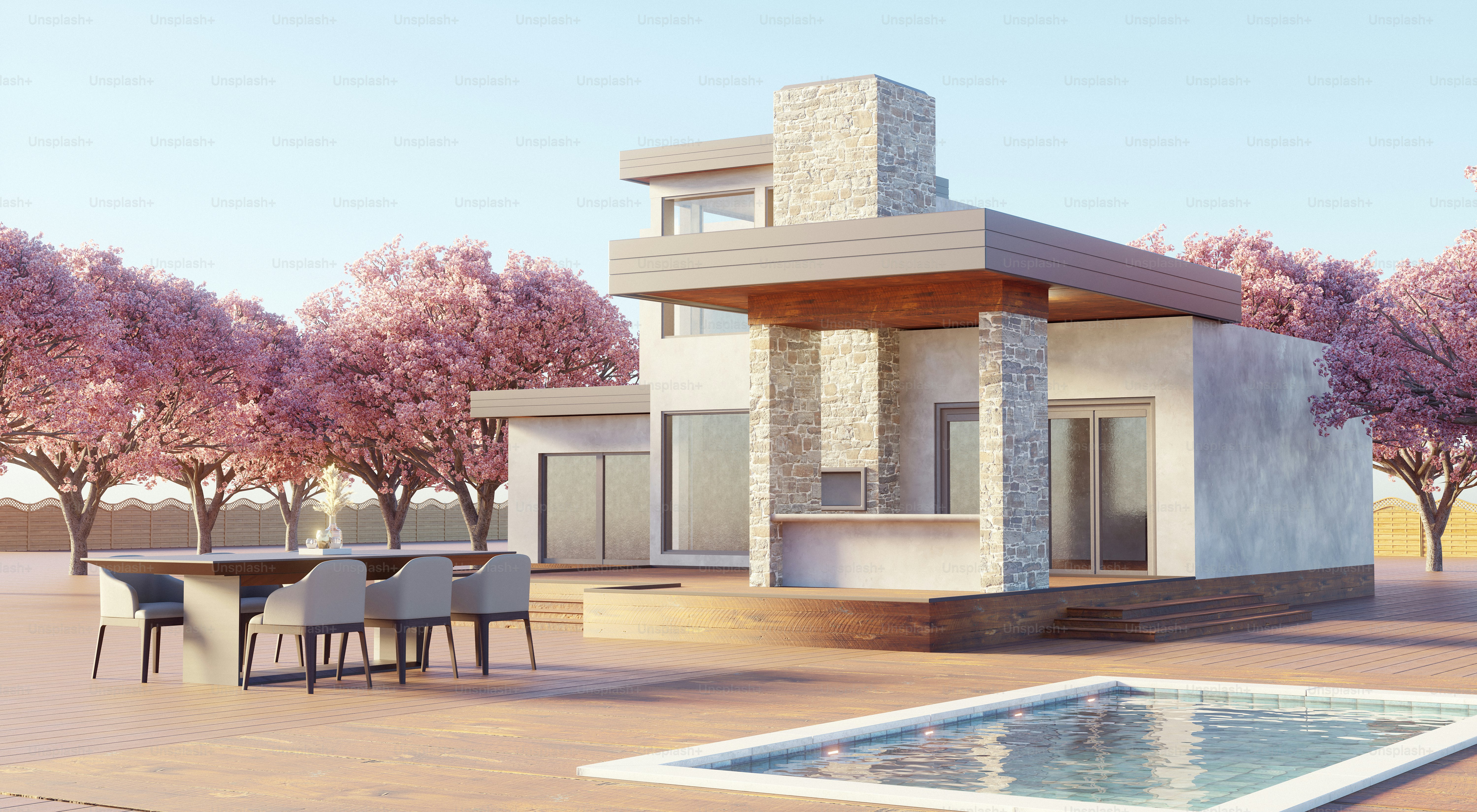 A modern house with a pool and blooming trees.