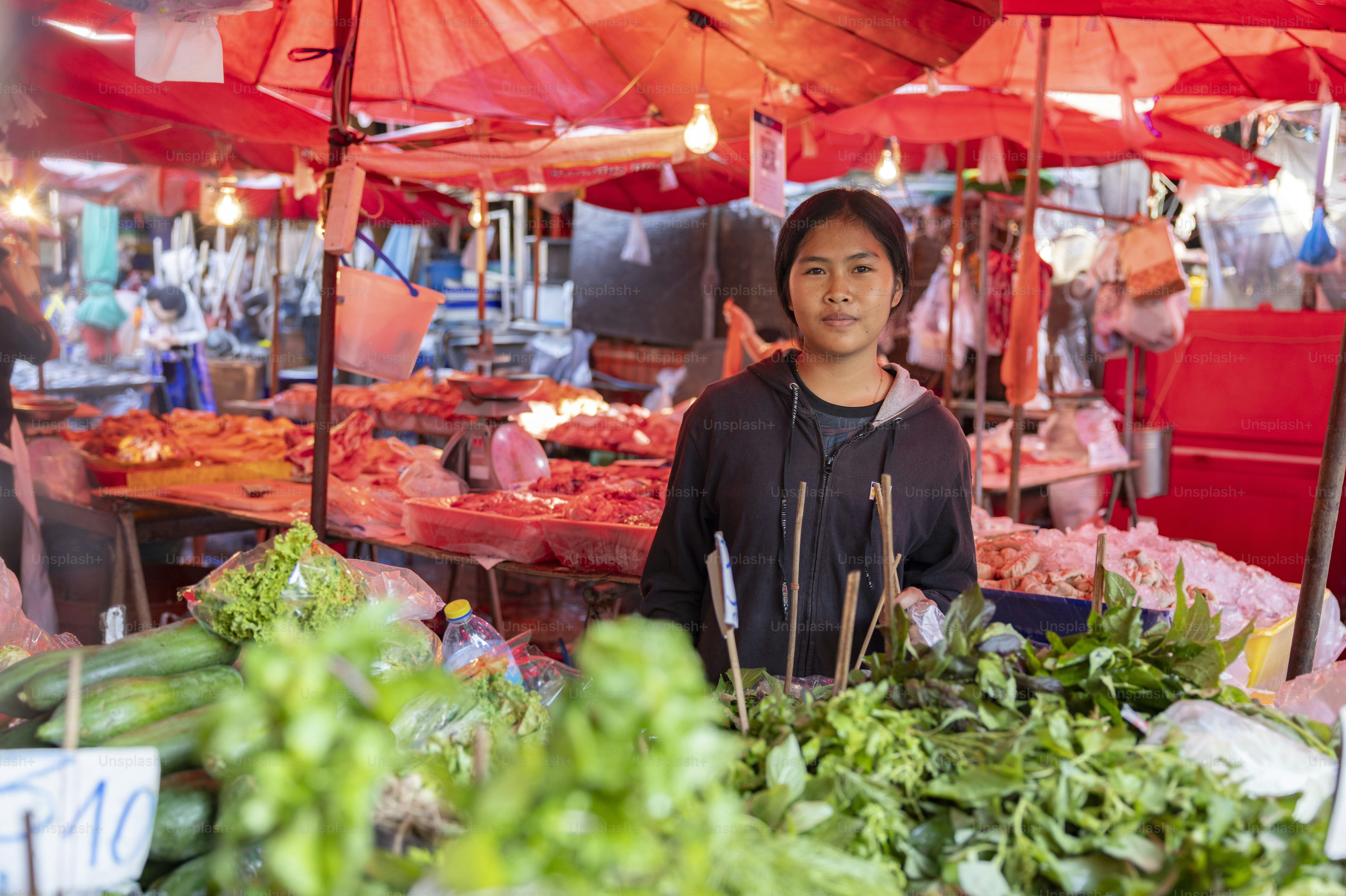 Traveler exploring a busy street market during a Southeast Asia backpacking itinerary