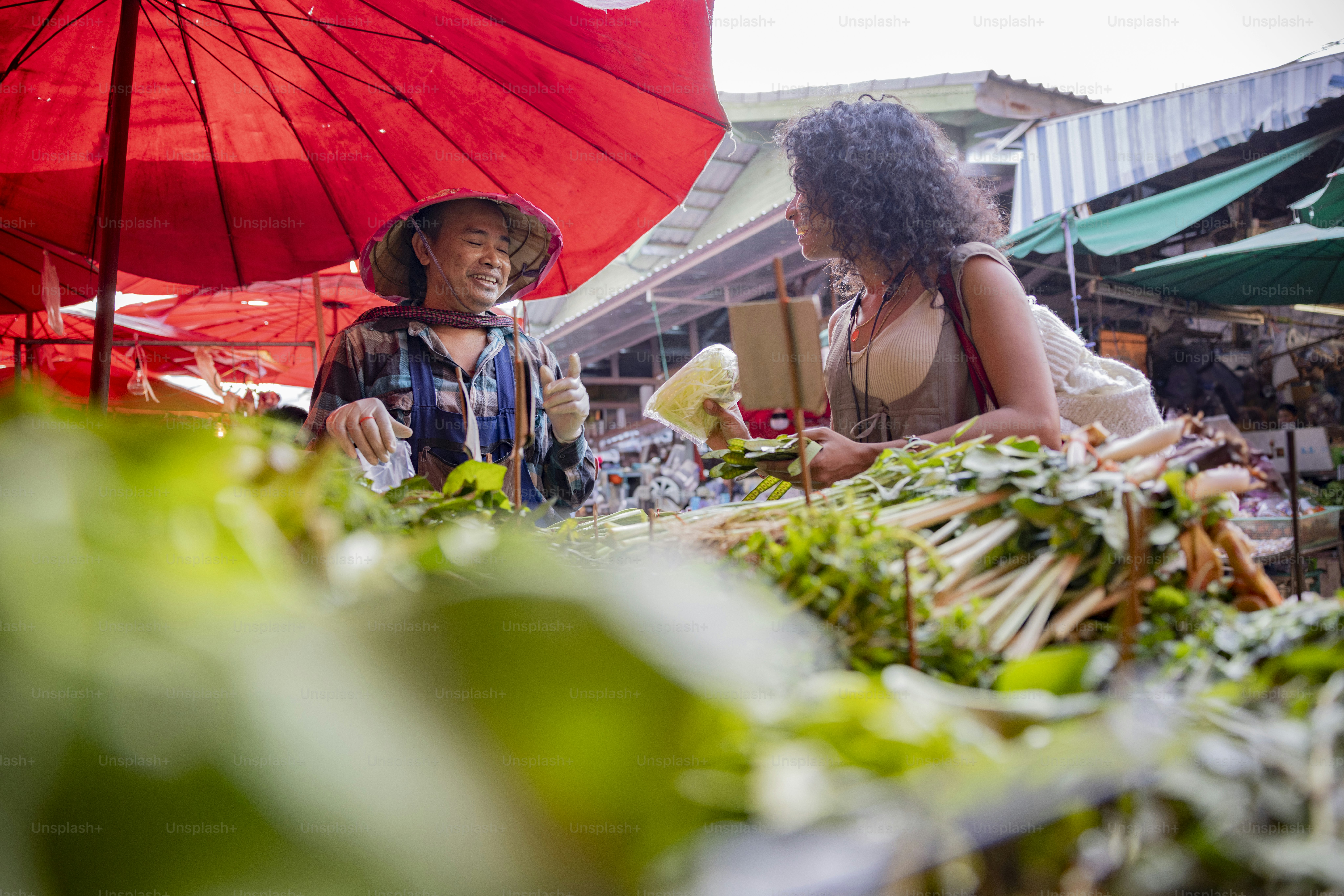 Fresh produce is displayed at a bustling outdoor market. photo – Food ...