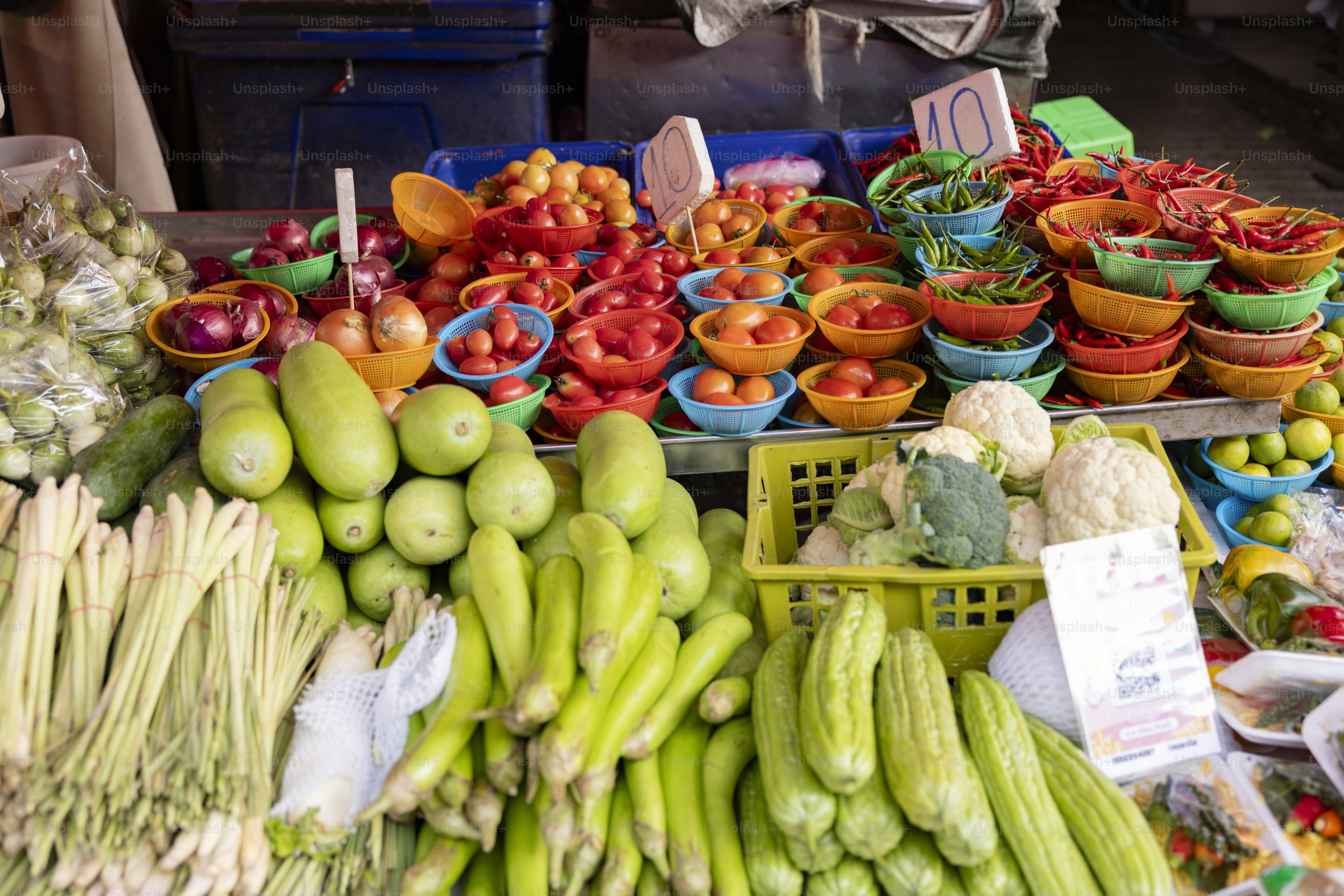 Fresh vegetables and fruits at a market stall.