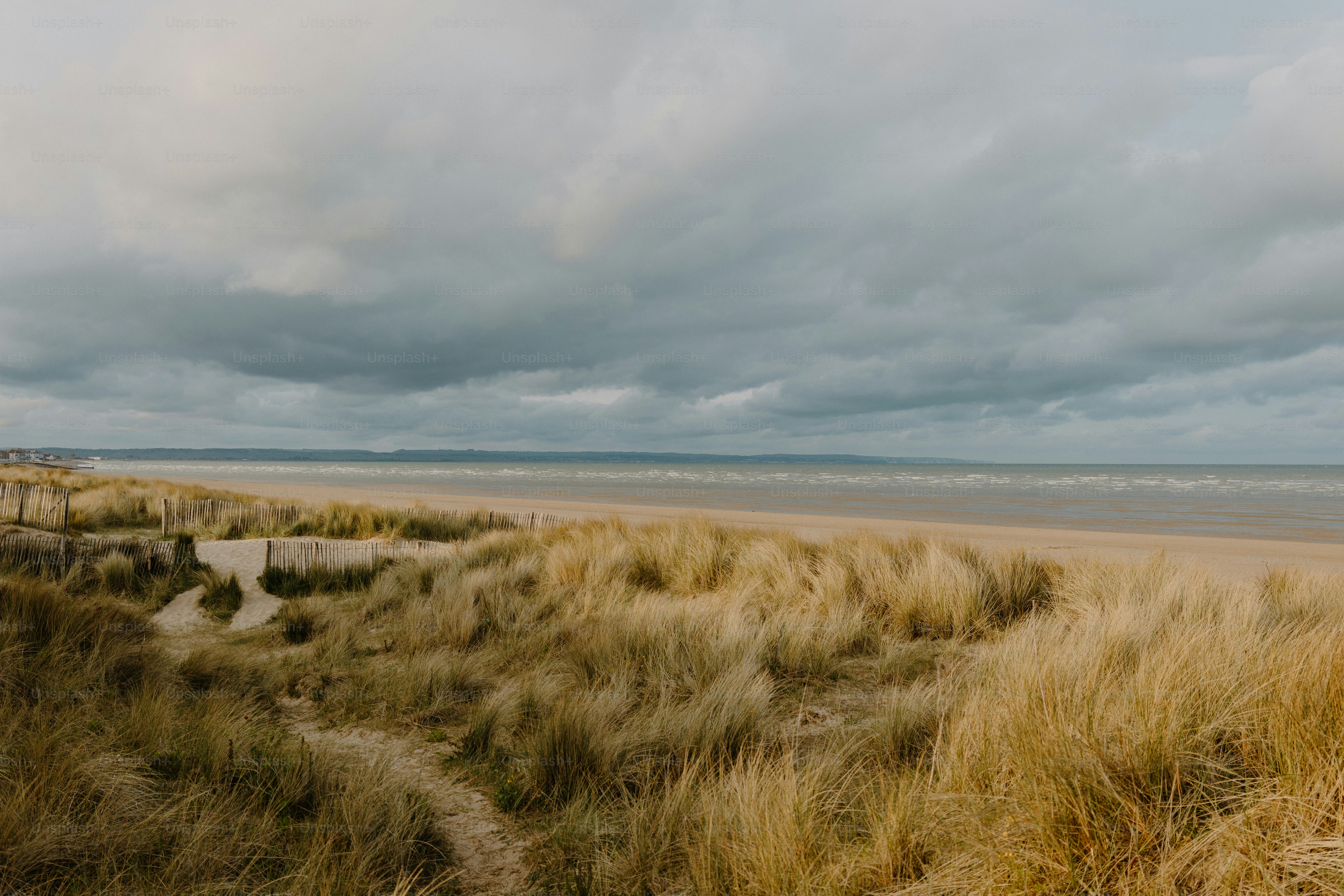 A cloudy day at a sandy beach.