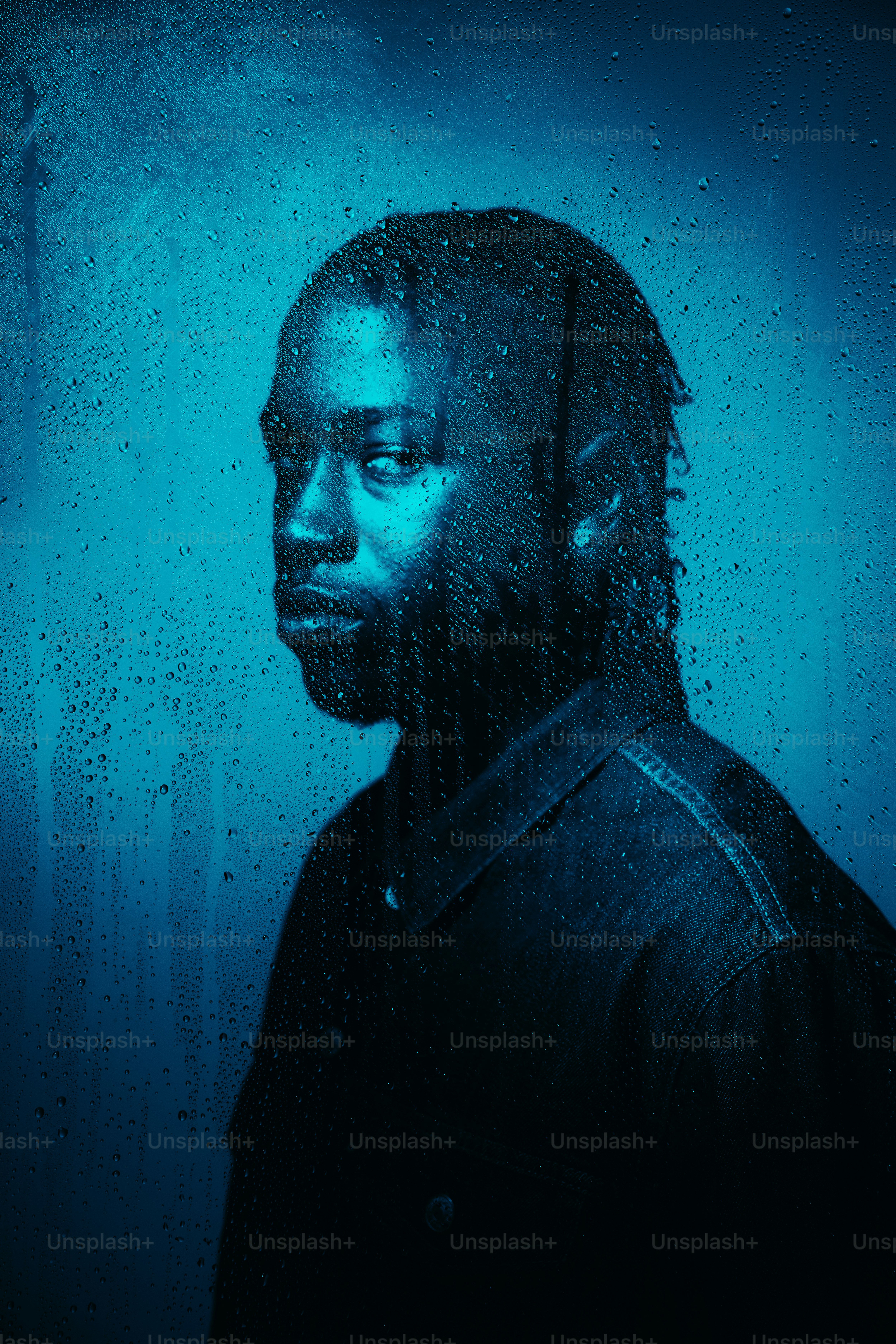 A portrait of a man in blue light. photo – Portrait Image on Unsplash