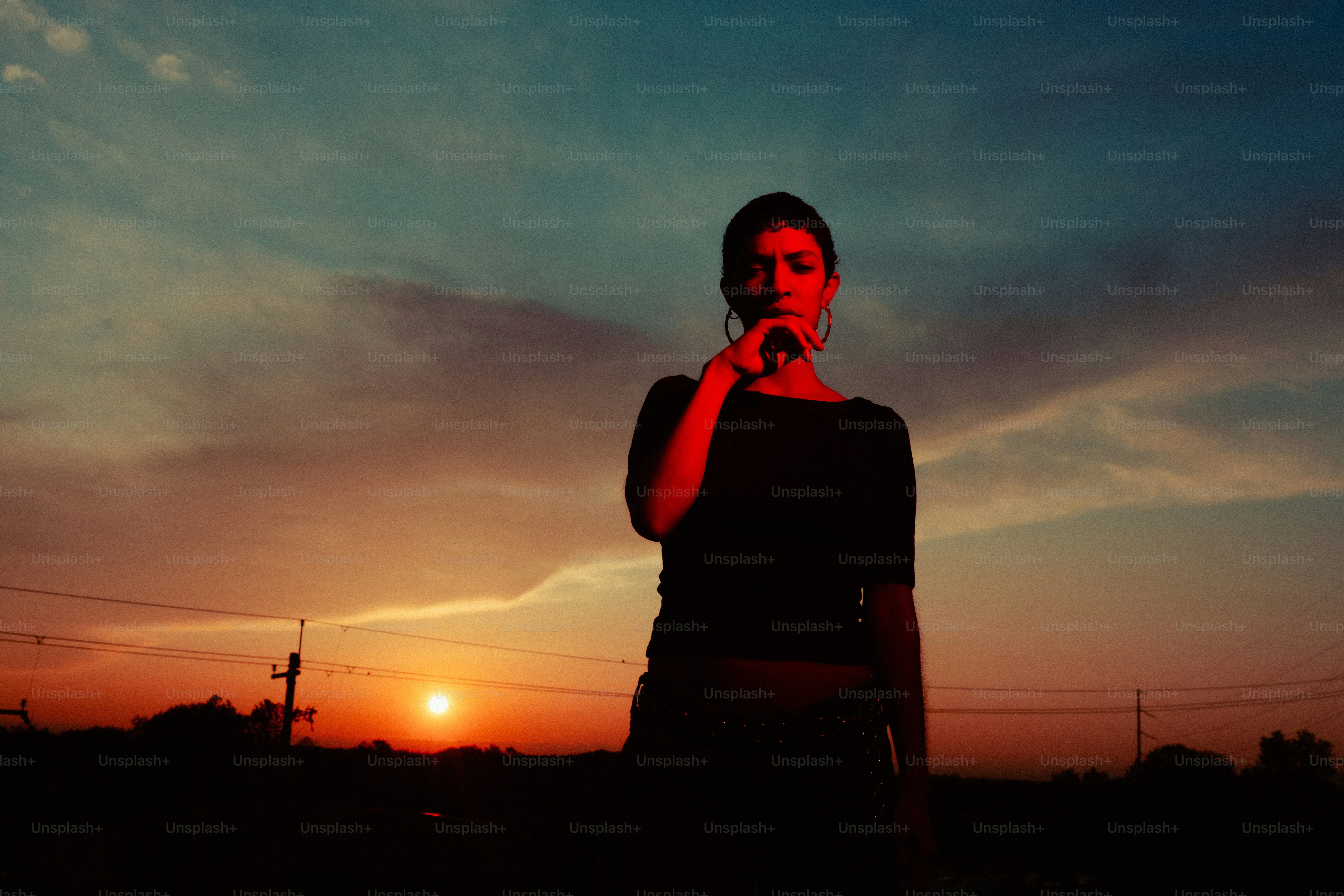 Woman silhouetted against the beautiful sunset sky.