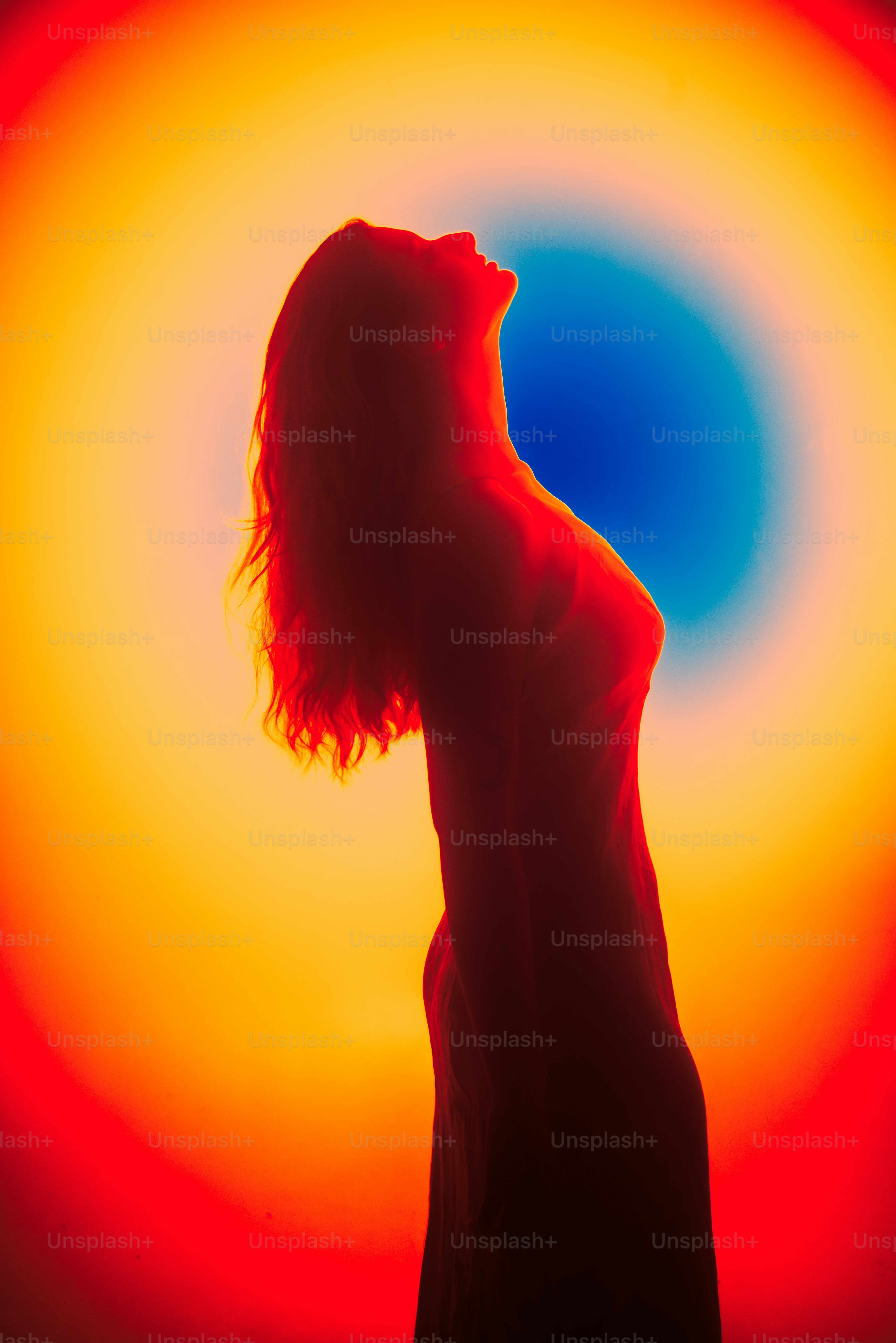 Silhouette of a woman against a colorful background. photo – Portrait ...