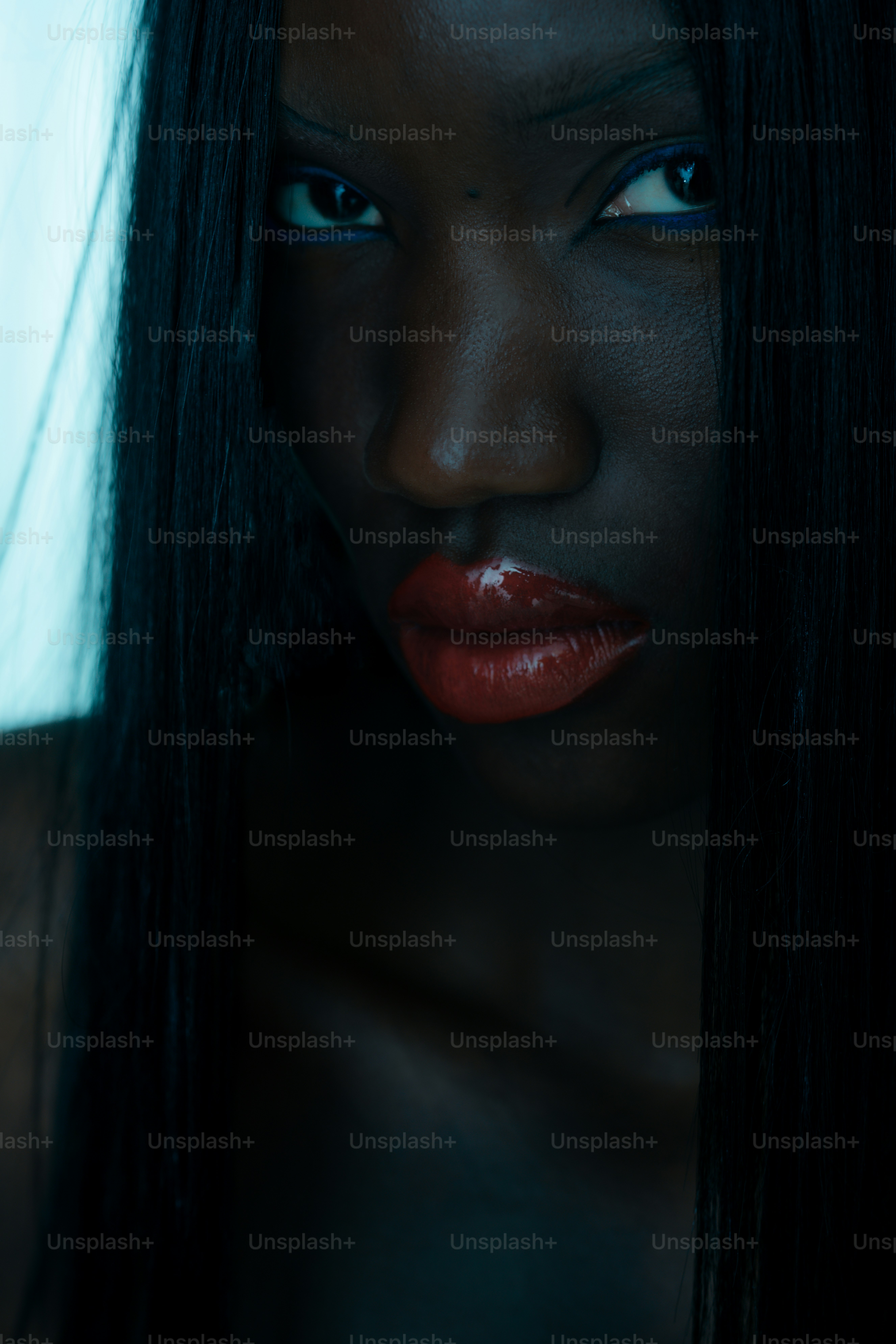 A stunning woman gazes intently.