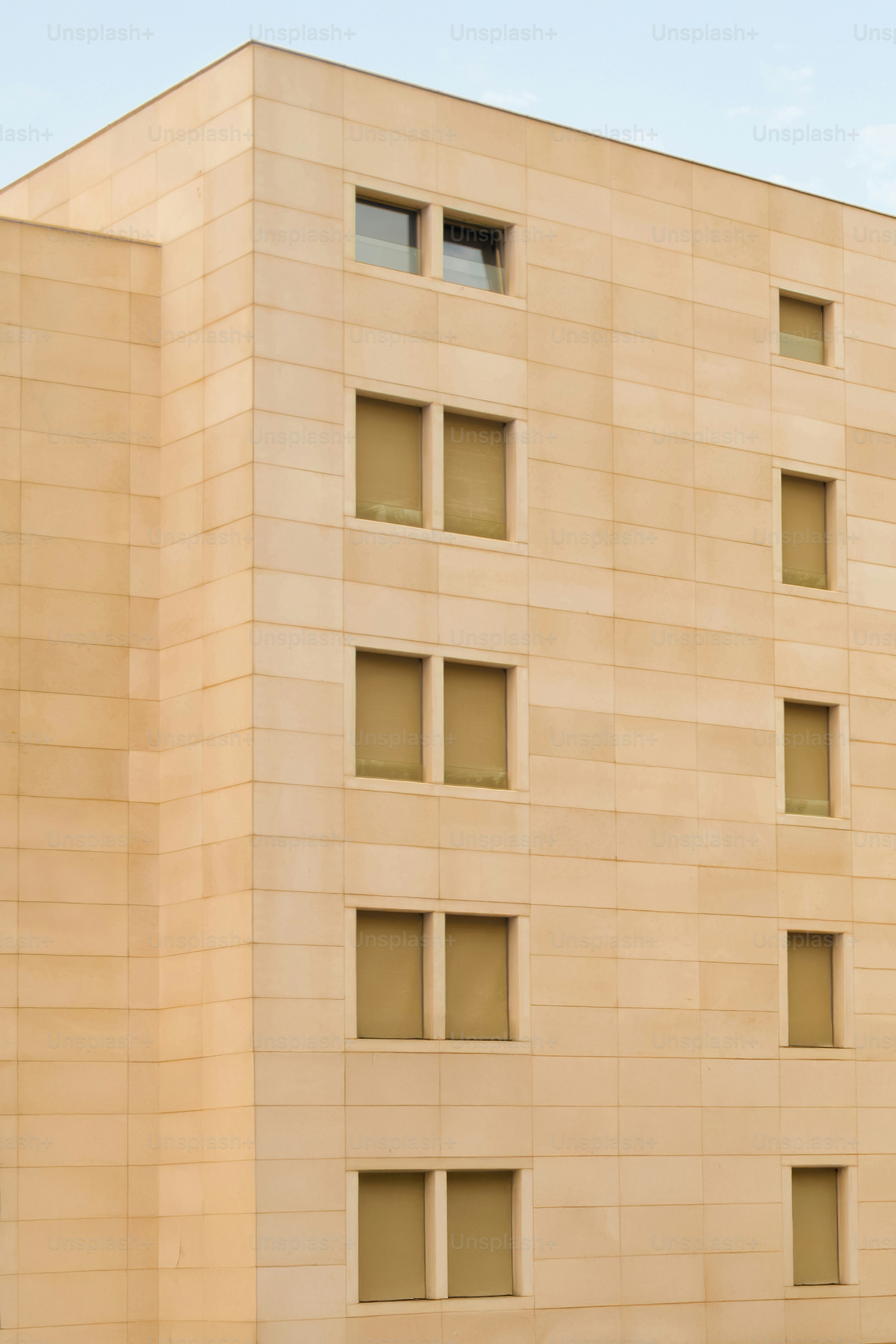Modern building with tan stone exterior. photo – Architecture Image on ...