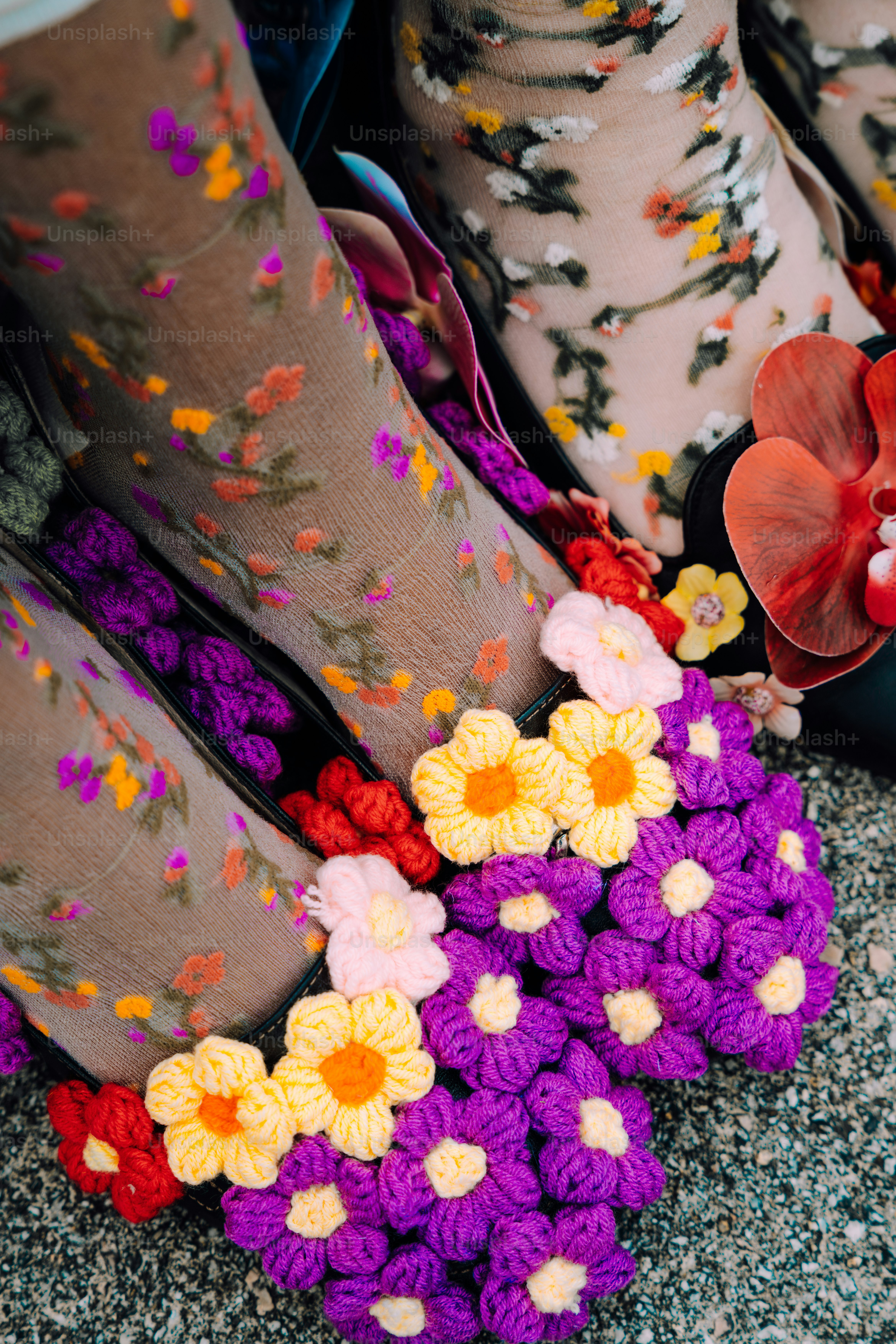 Floral shoes are displayed in a colorful arrangement.