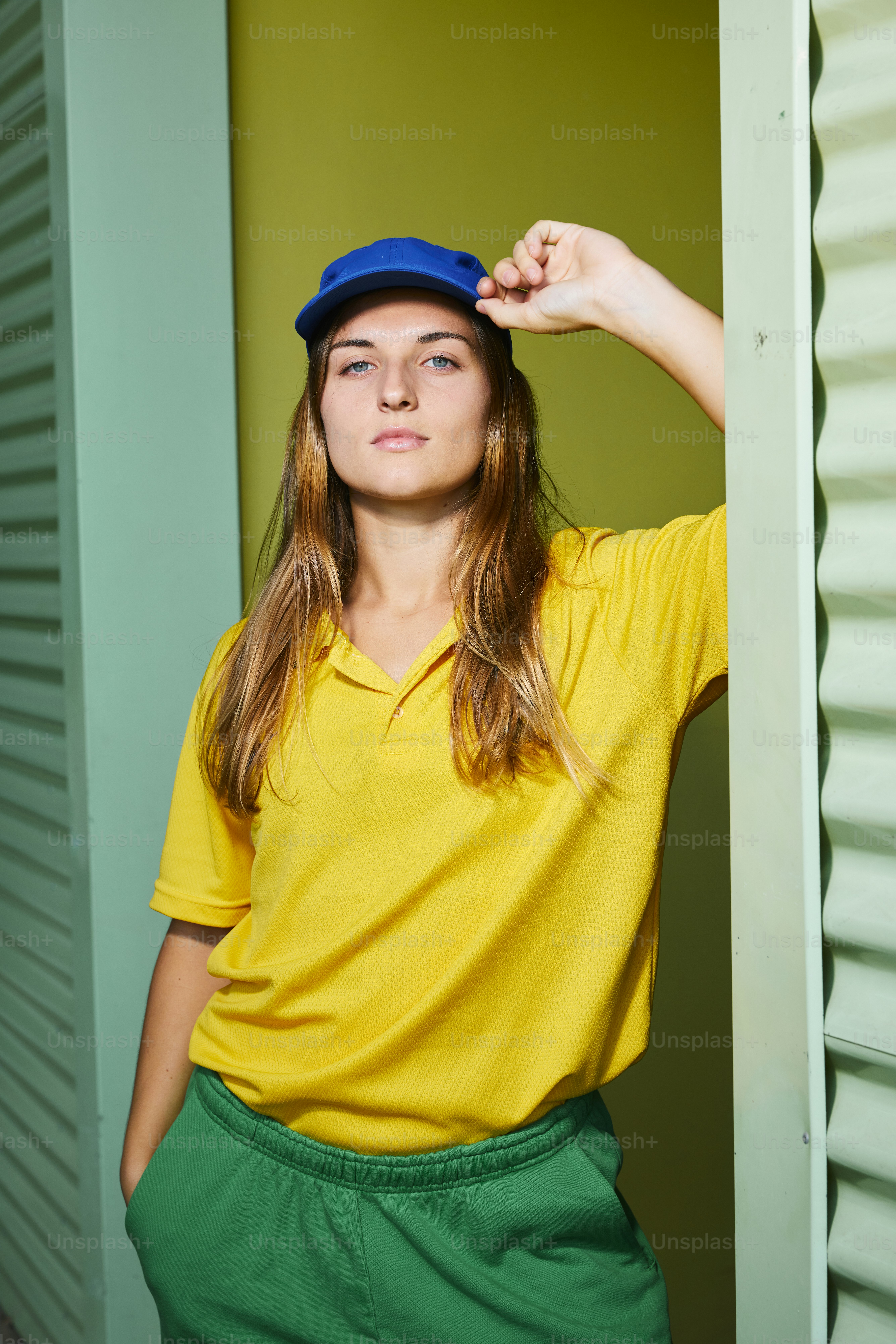 A young woman poses in casual summer attire.