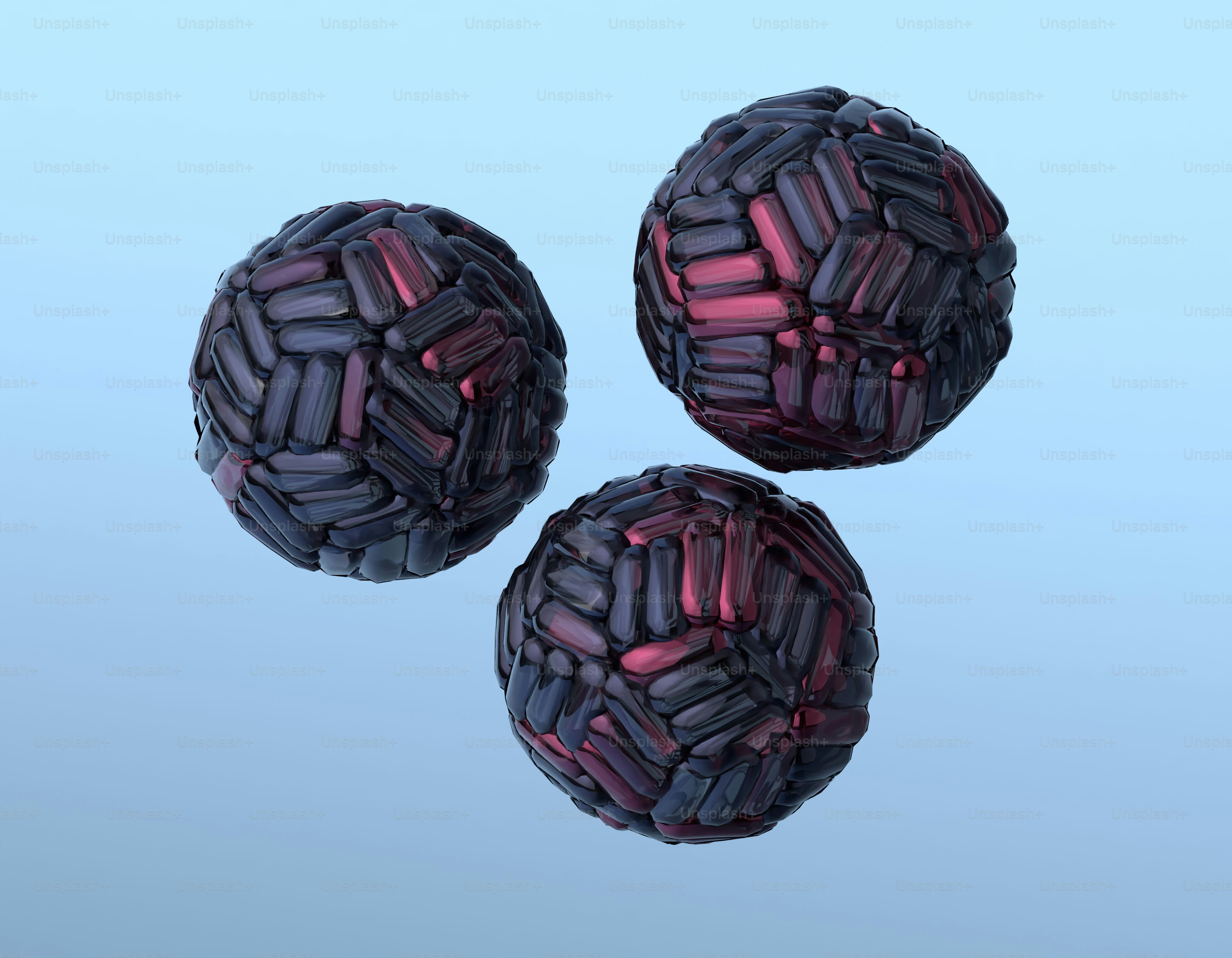 様式化された模様の3つの球体が空中に浮かんでいます。