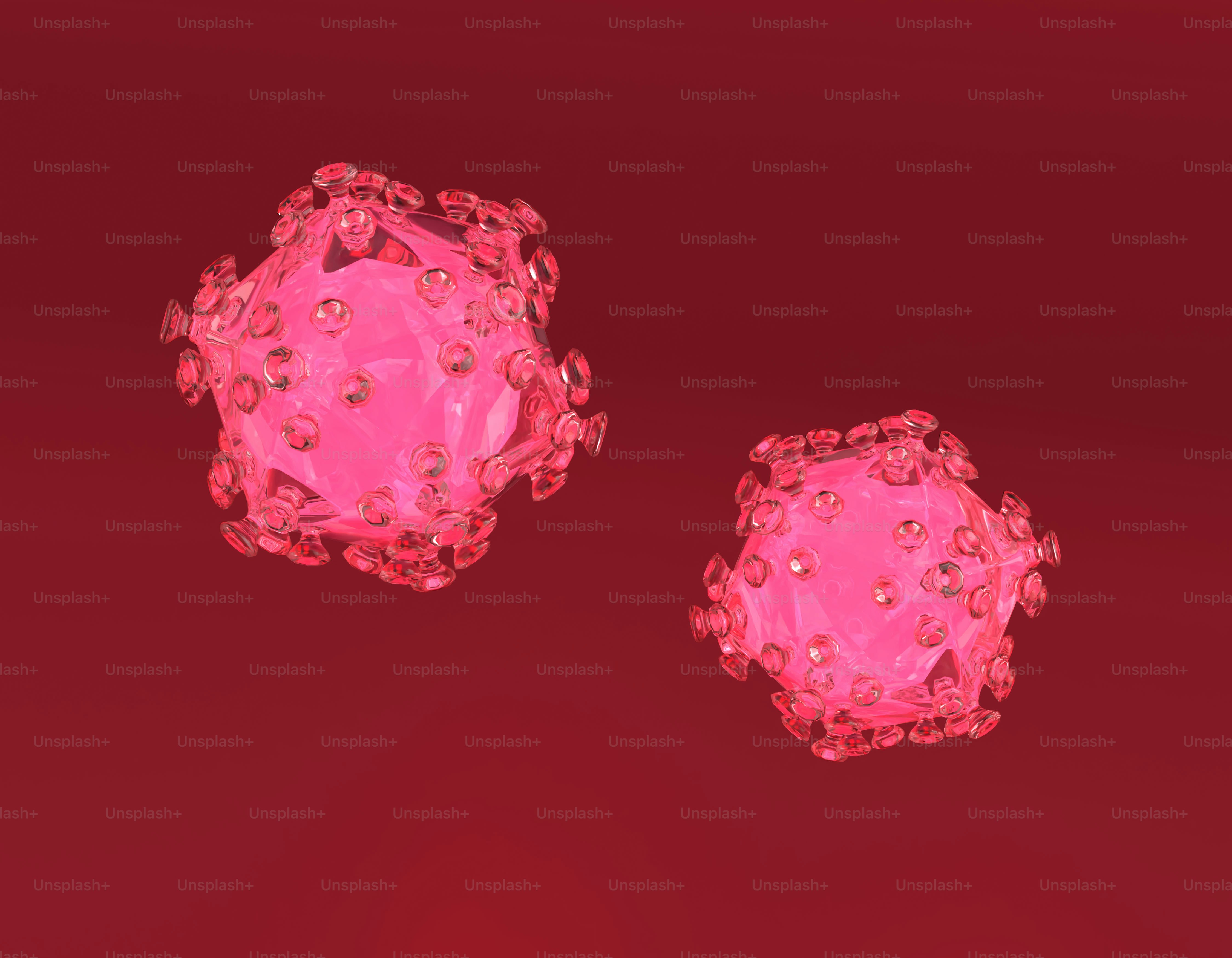 Two pink, virus-like shapes float against red background.