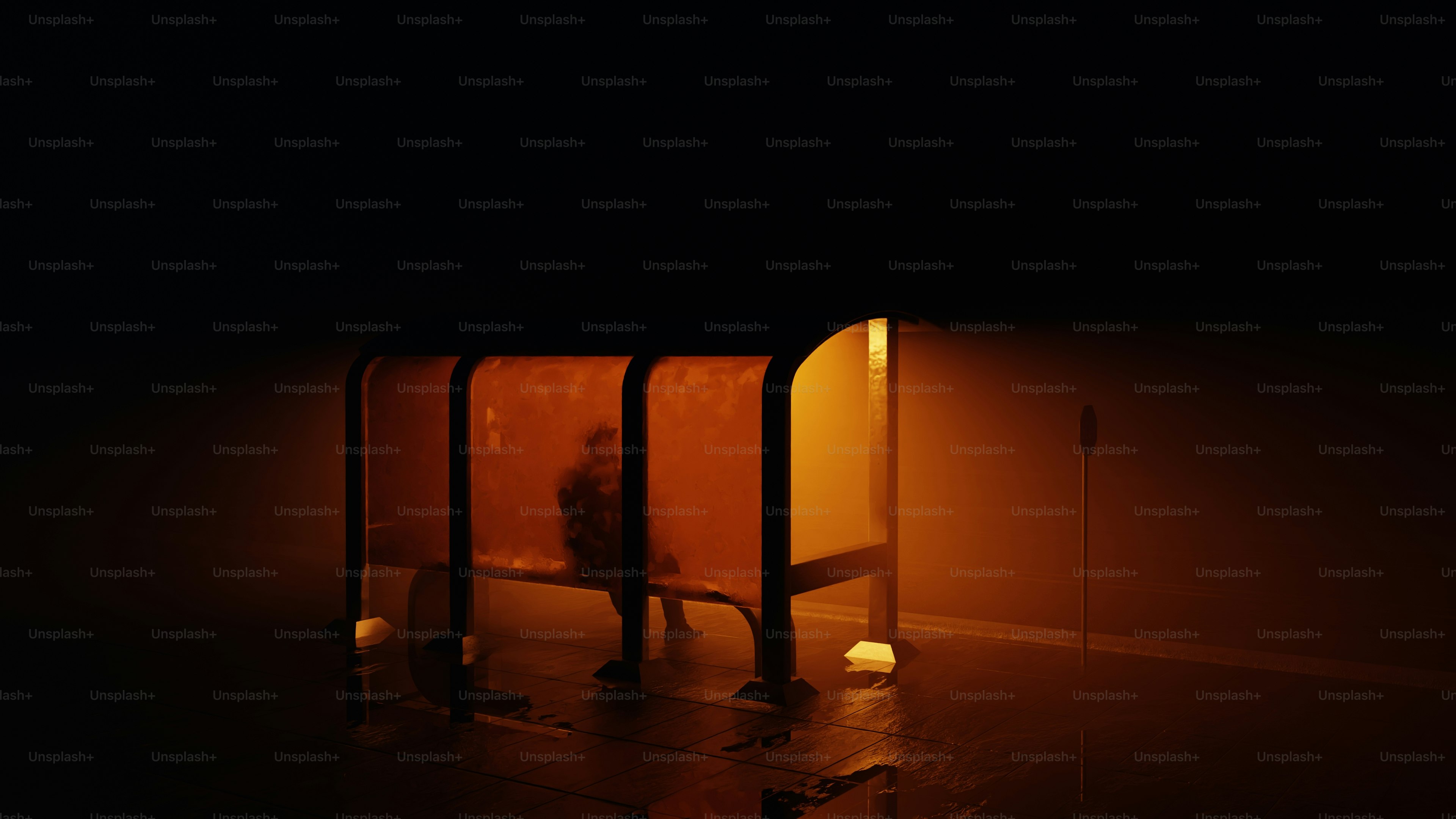 A person sits alone in a bus stop.