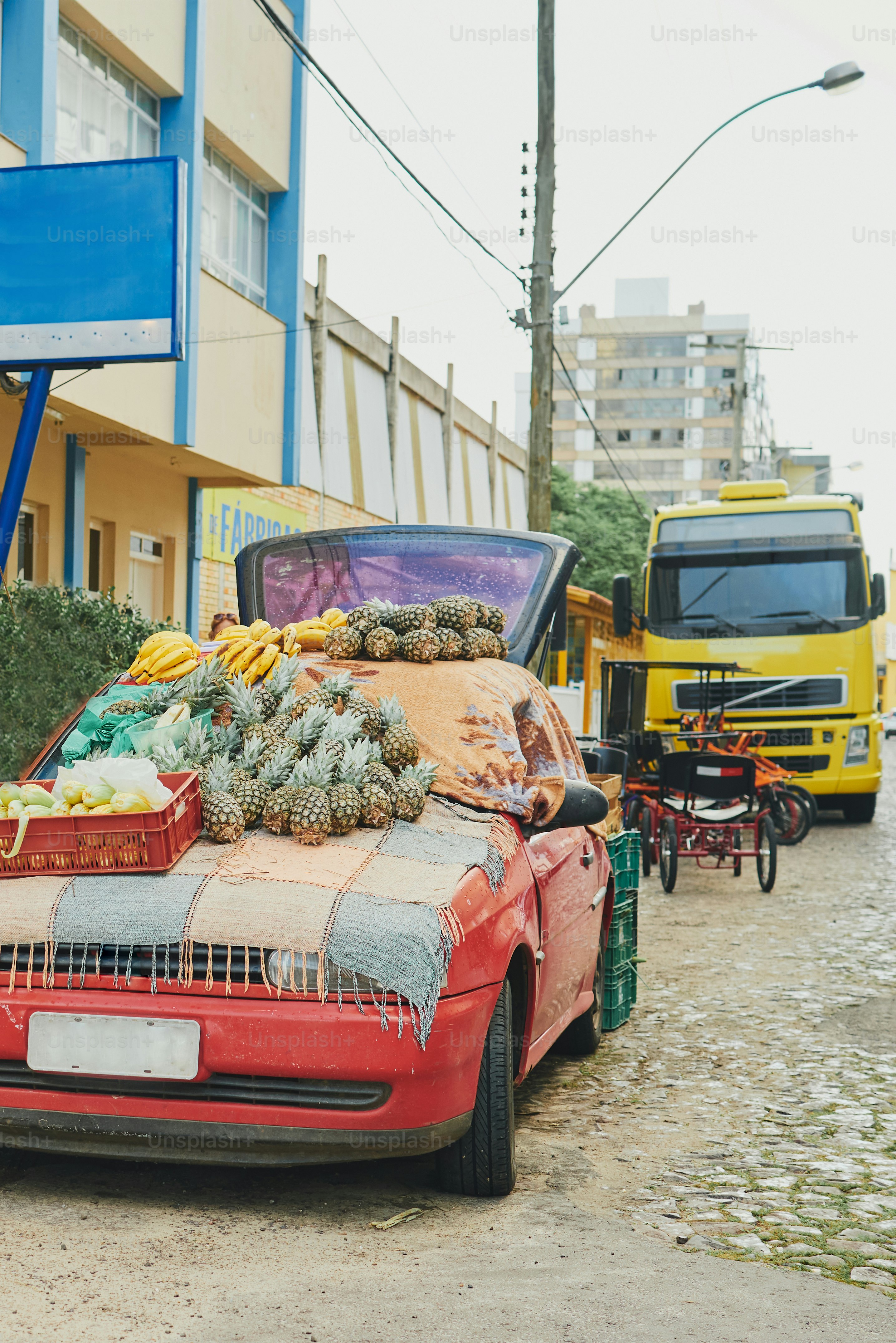 Car is selling fruit by the roadside.