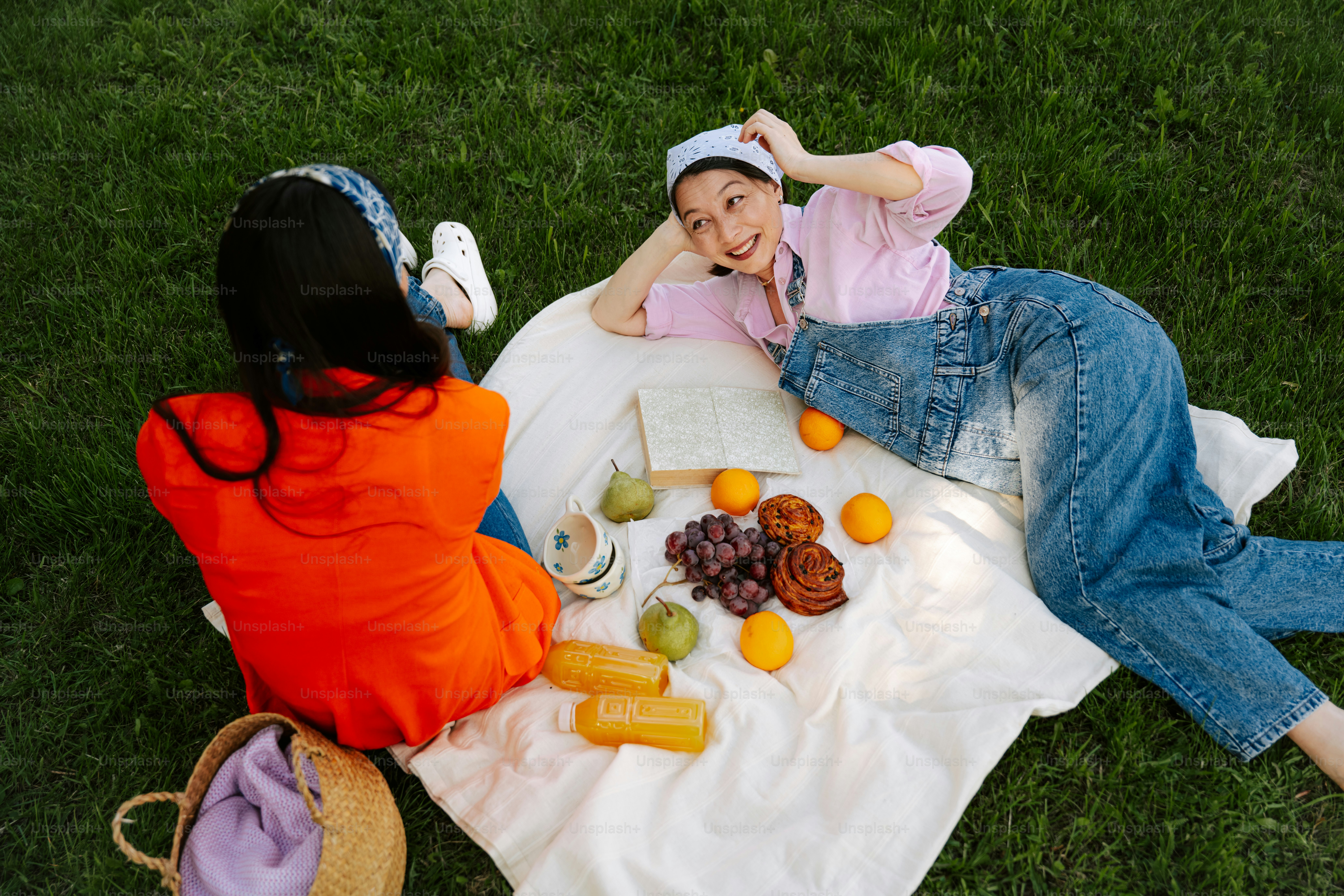Friends enjoy a picnic on a sunny day.