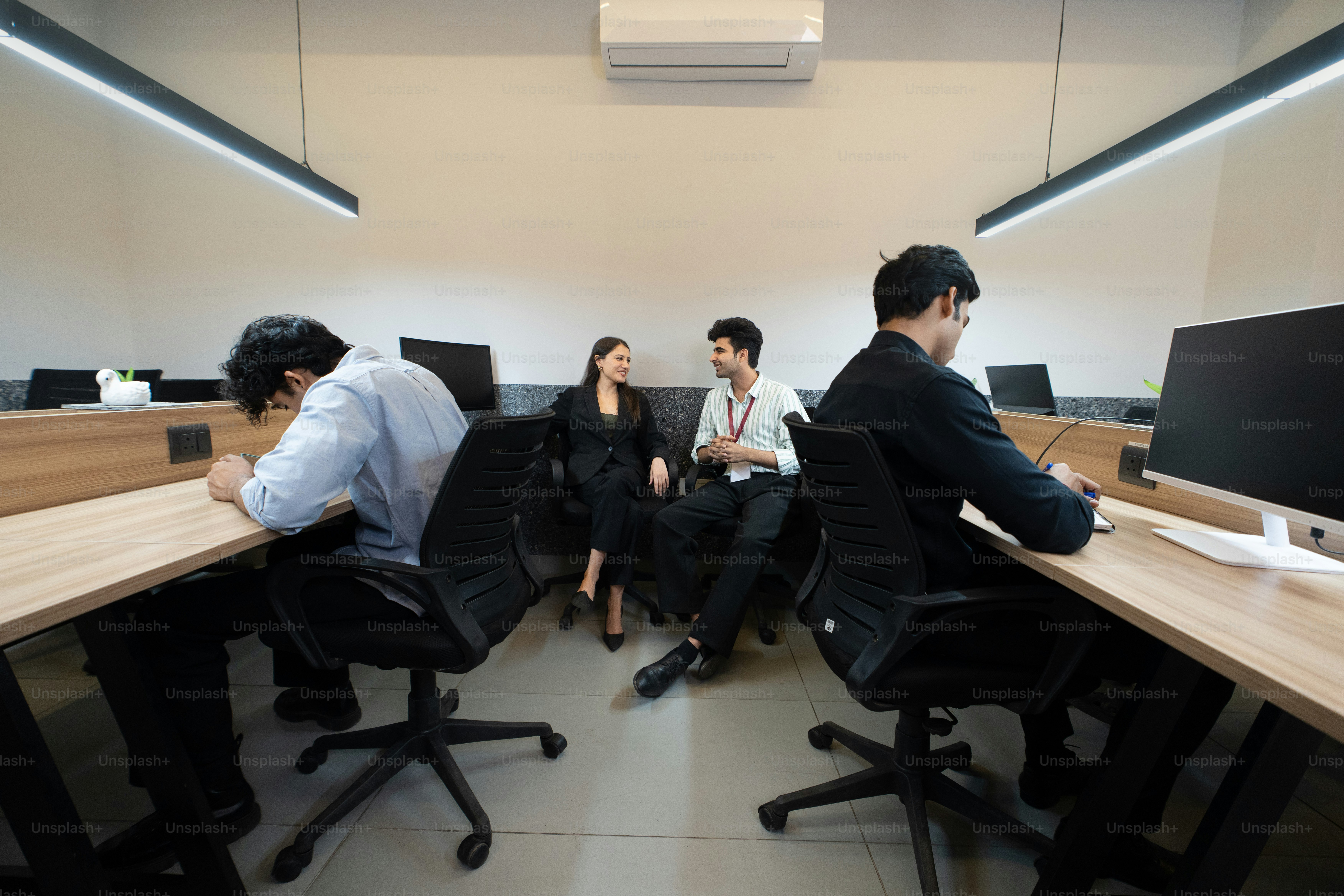 People work and talk in a modern office.