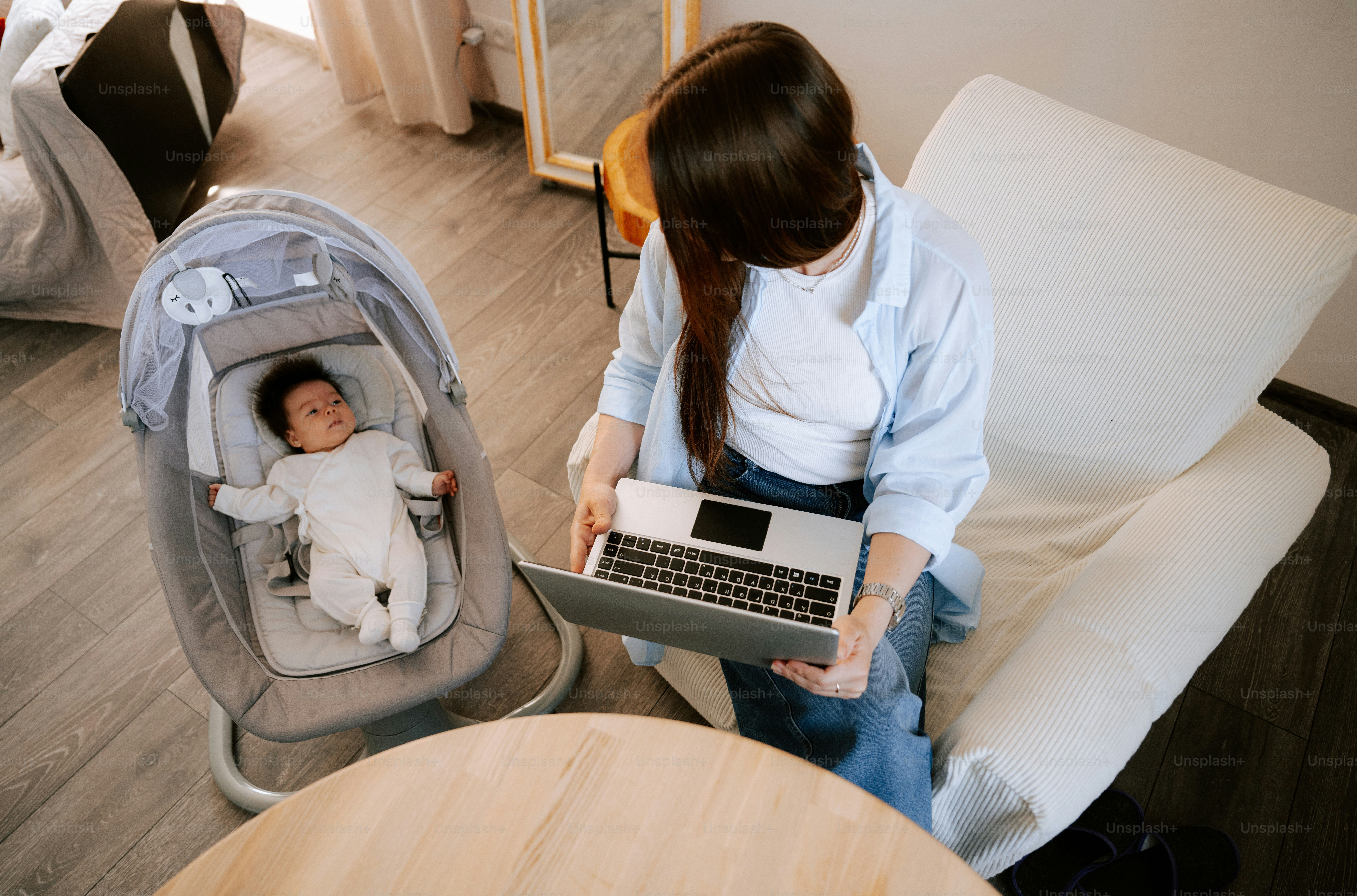 Working mom with a baby in the crib.