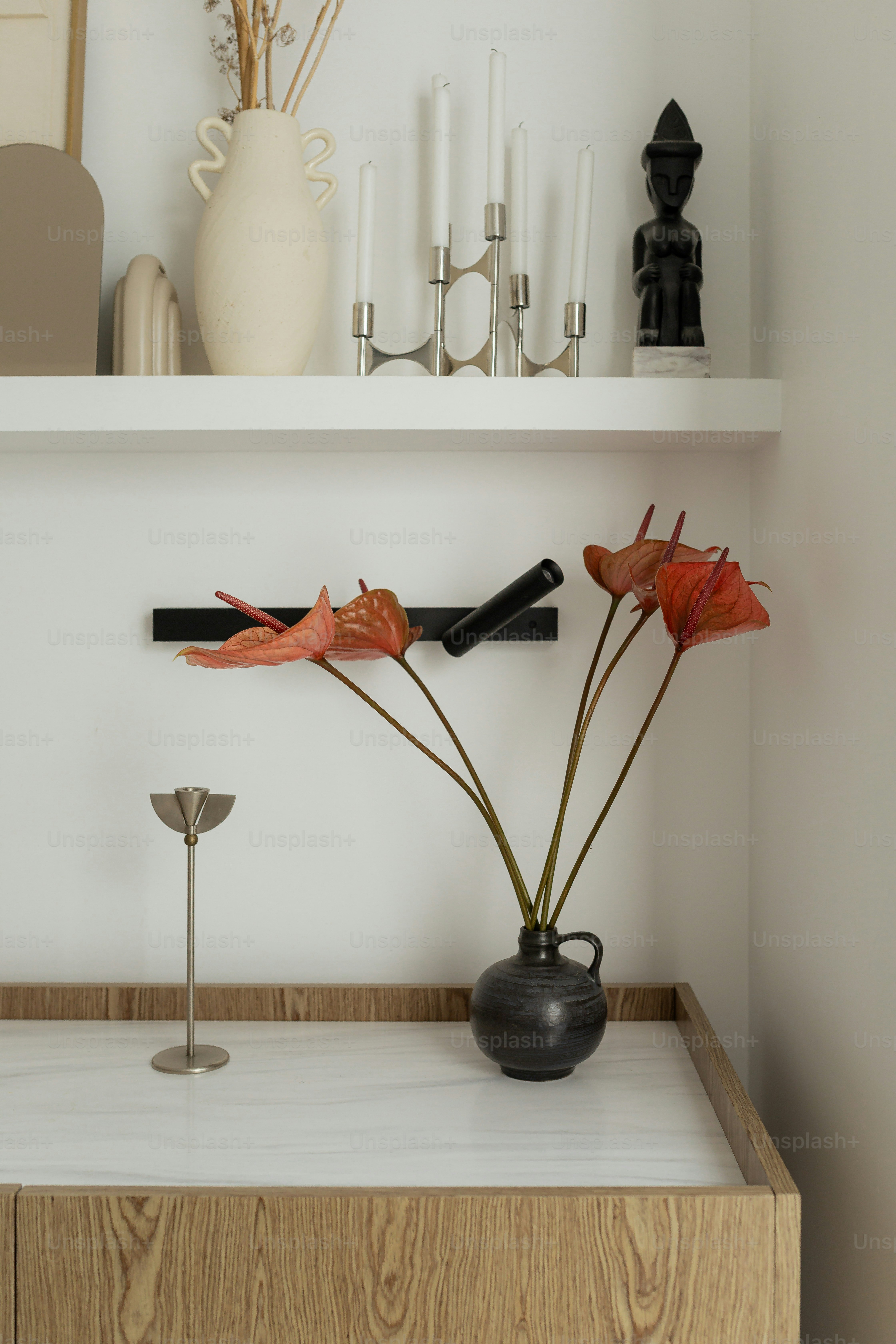 Stylish and minimalist decor with flowers and shelves.