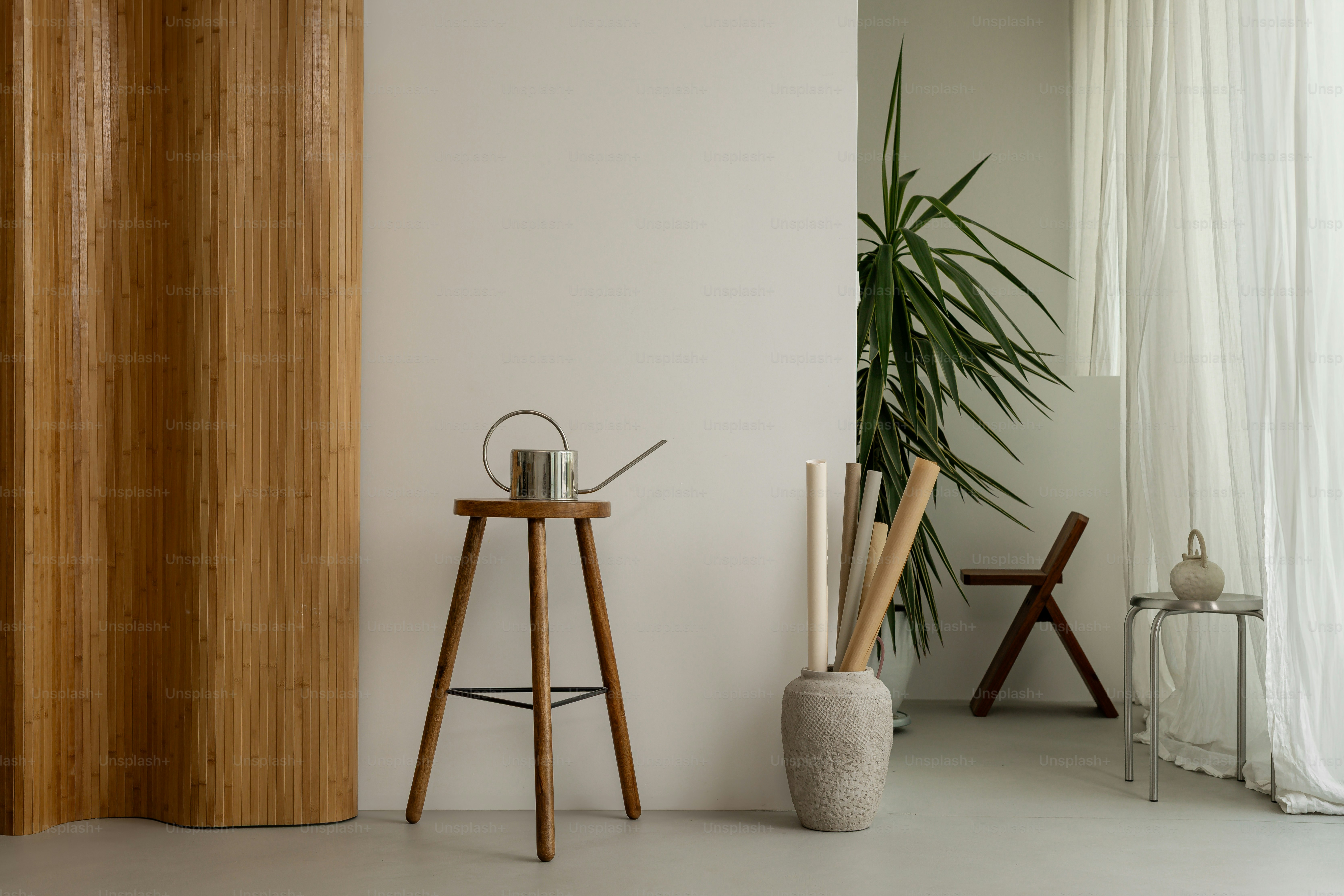 A minimalist interior with wood and plants.