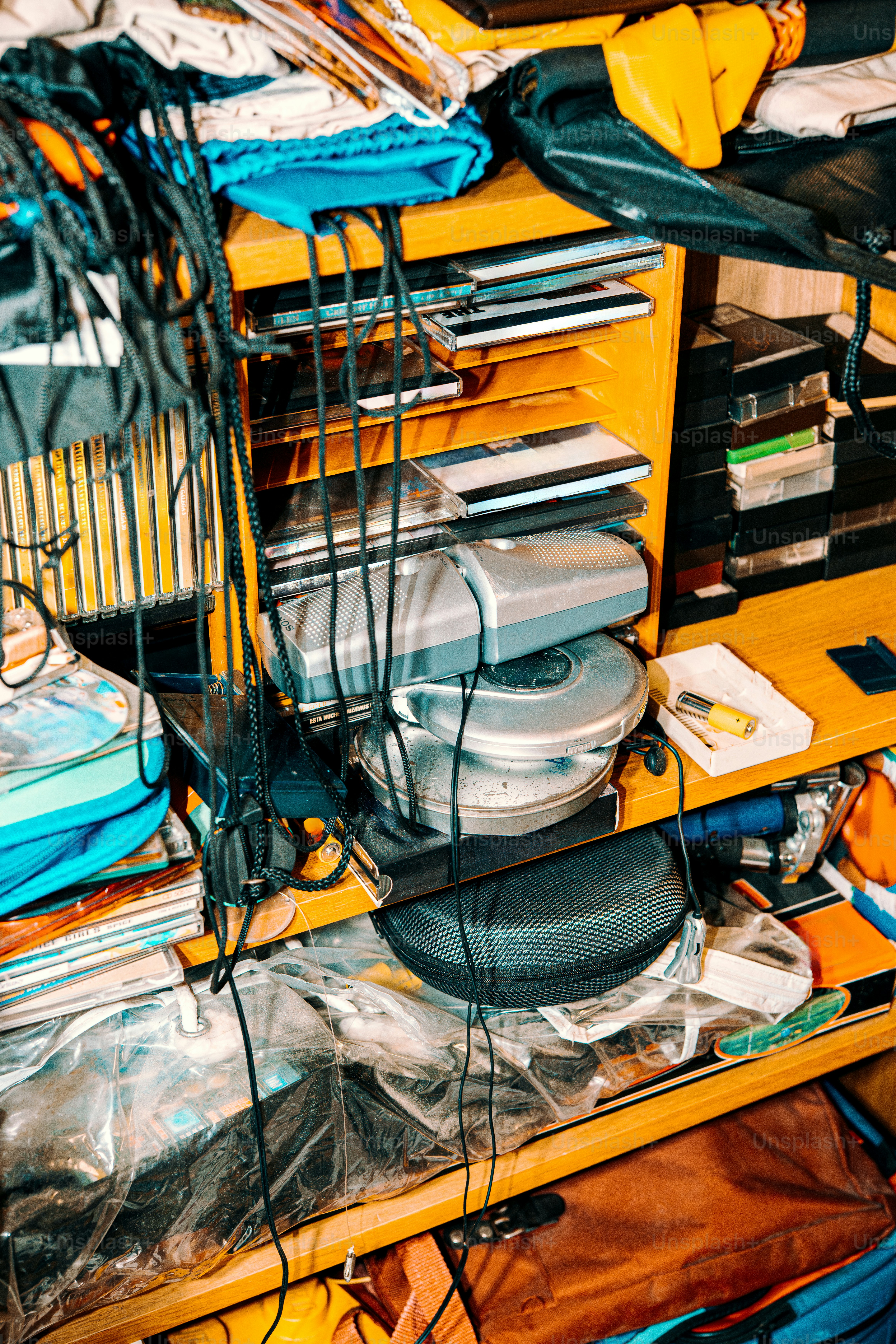 A chaotic shelving unit packed with items.