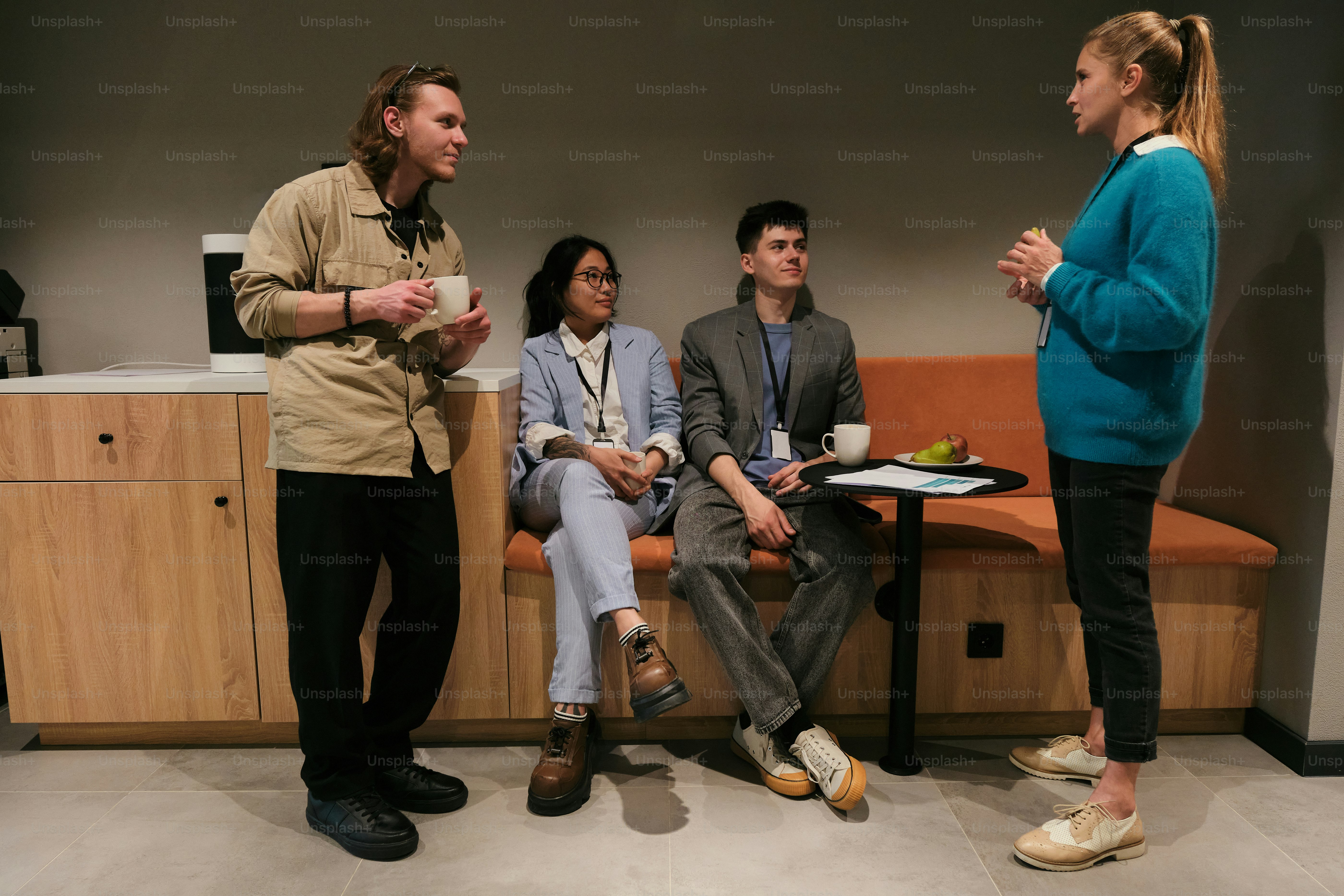 Coworkers are chatting during a break at the office.