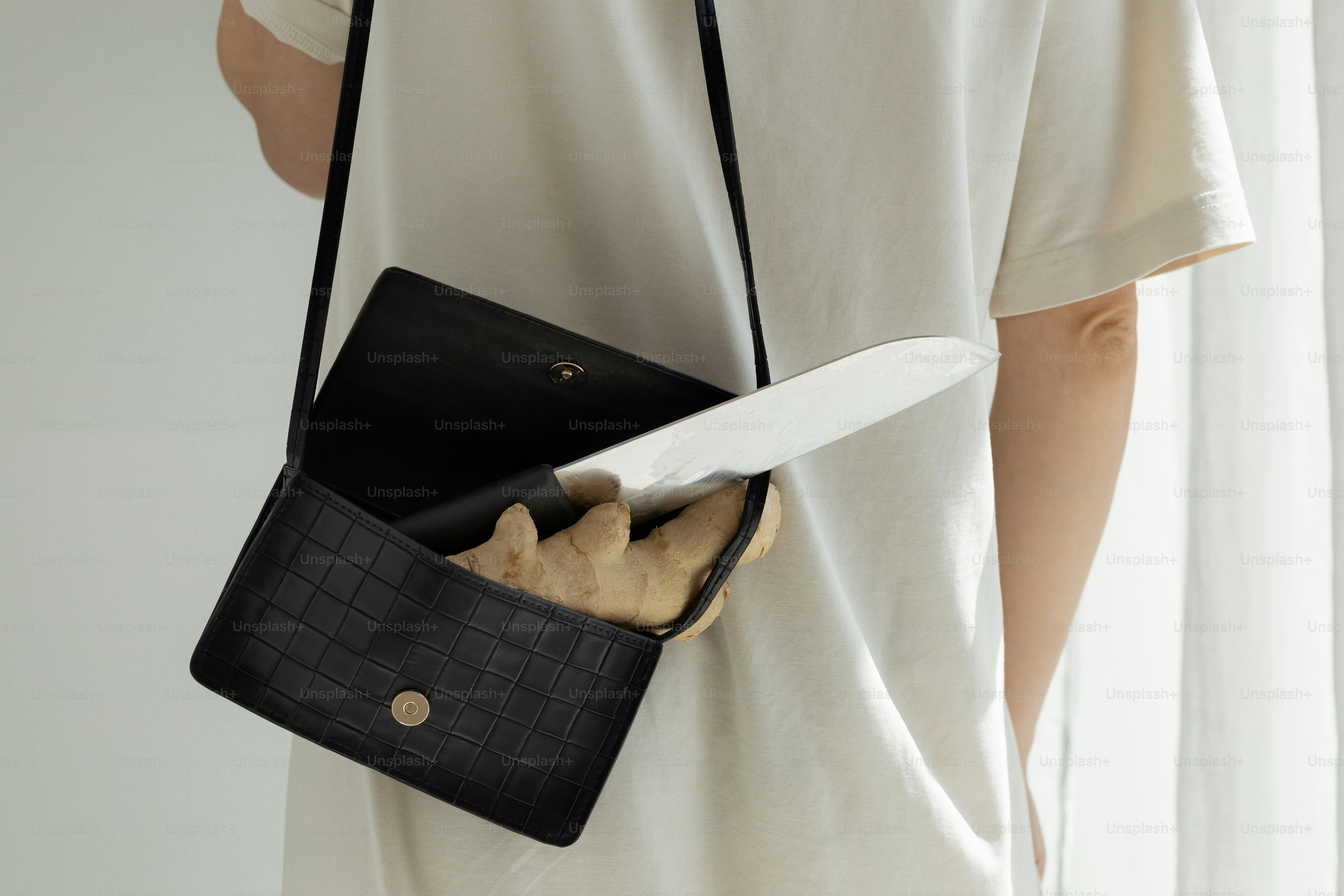 Knife in purse from Unsplash