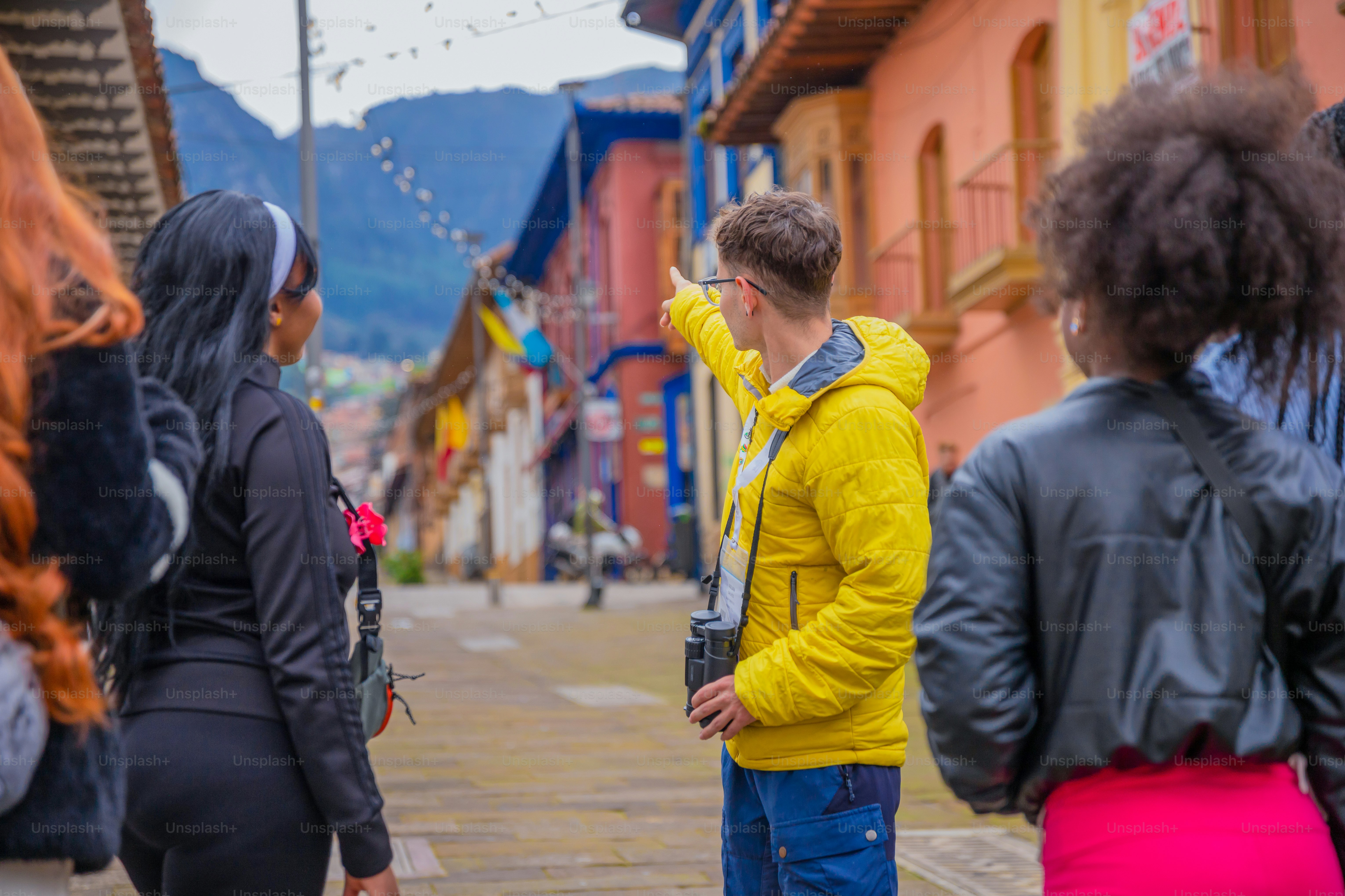 Group of people exploring a colorful city.