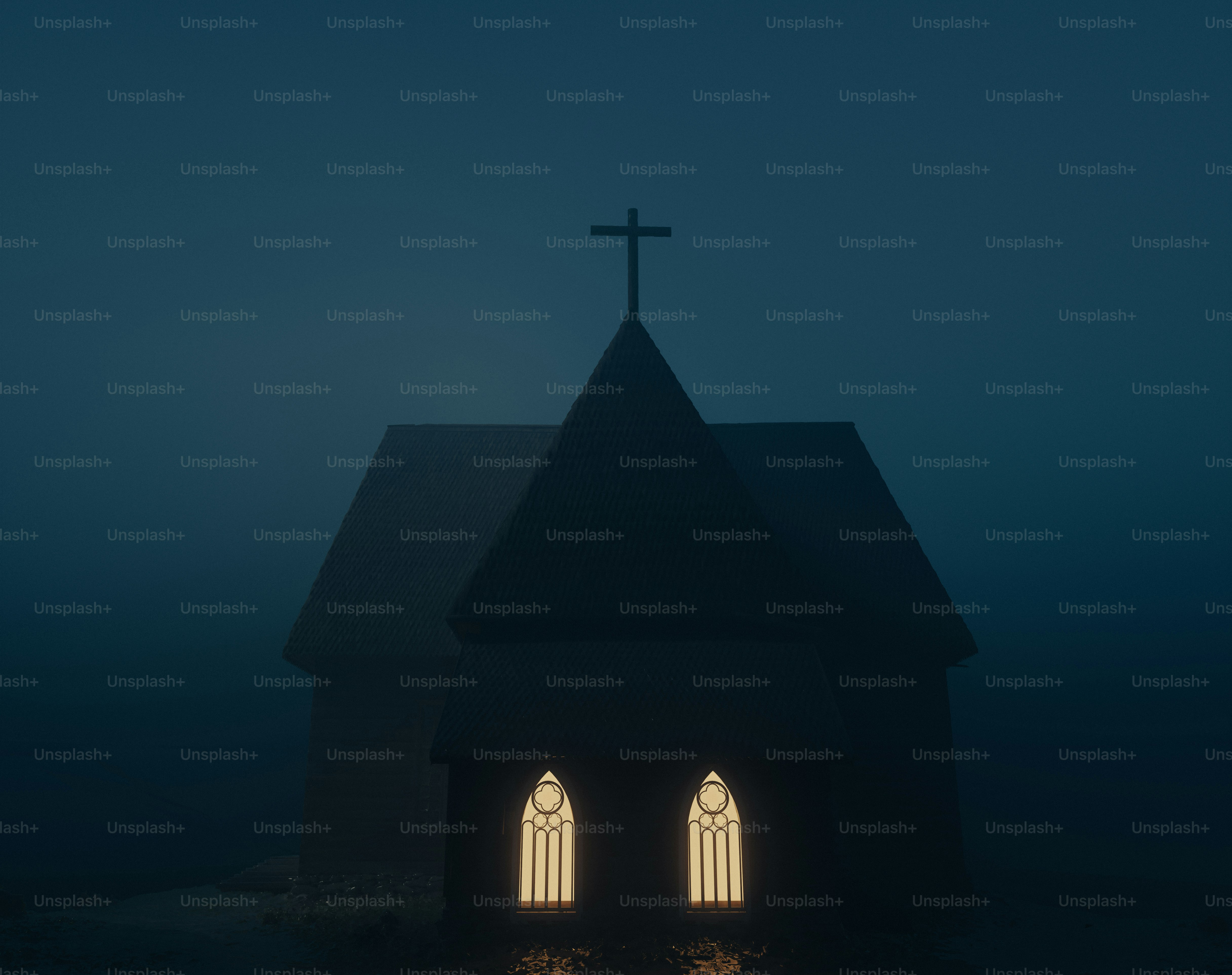 A church stands silhouetted in the heavy fog.