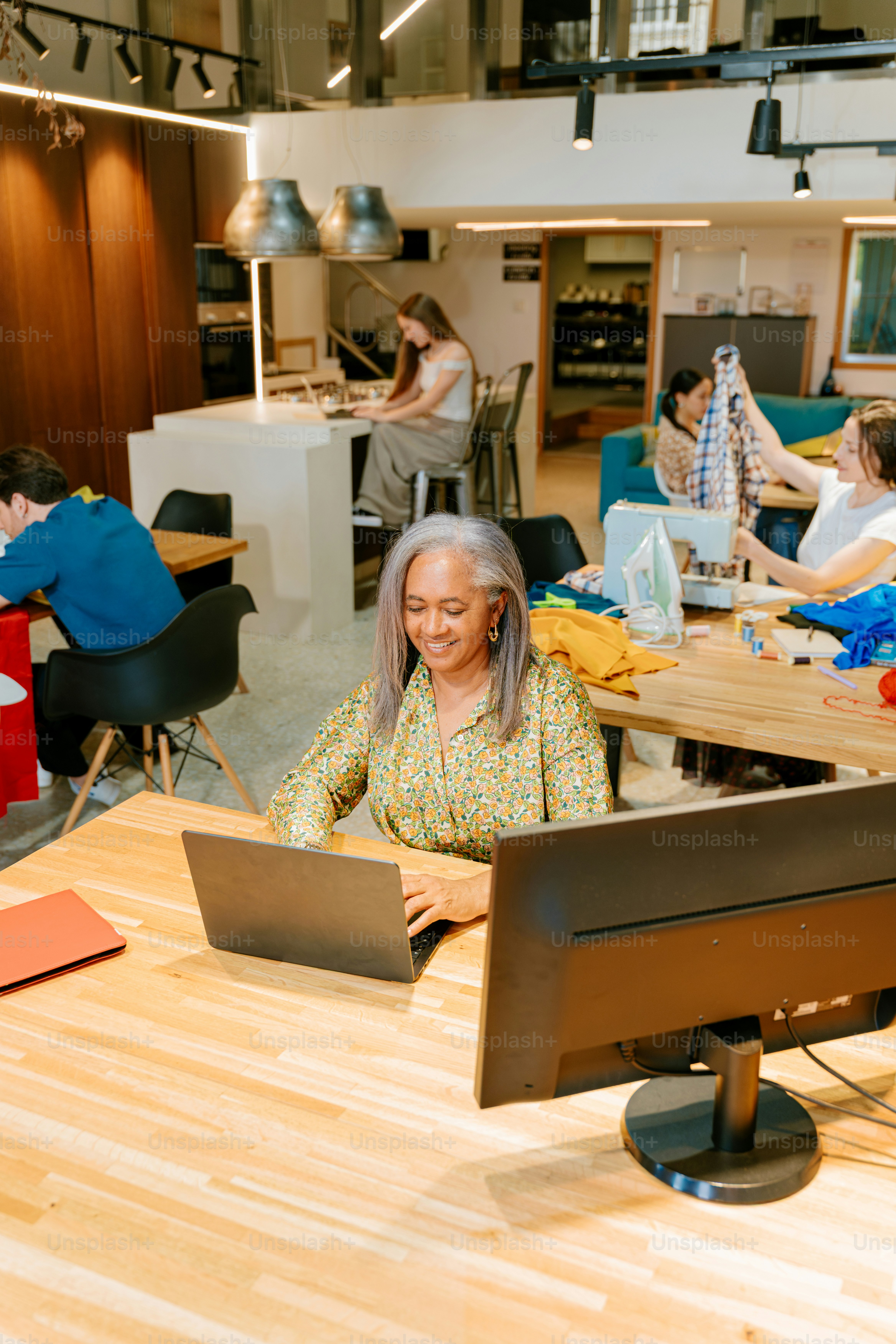 People work and collaborate in a shared workspace.