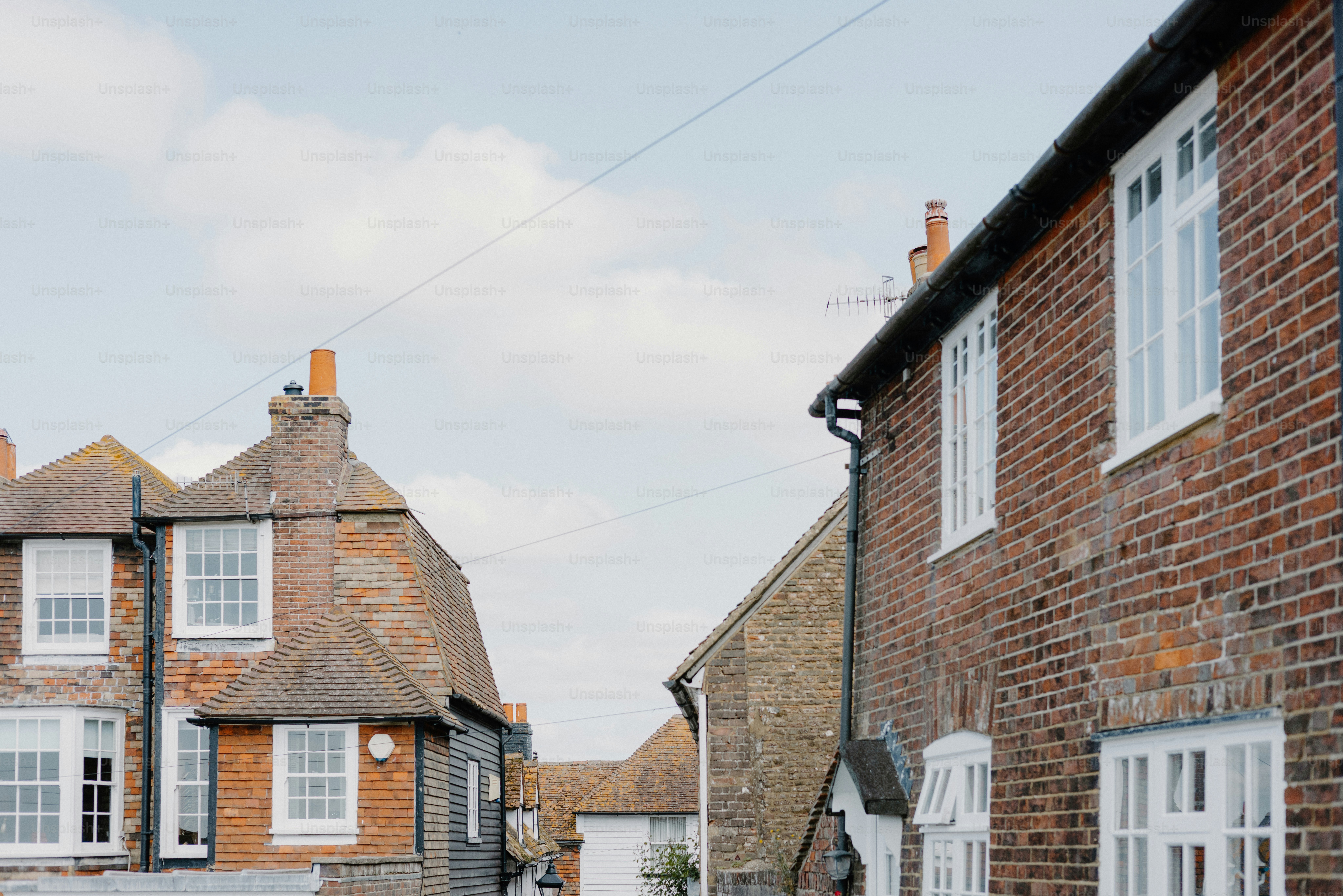 Brick buildings and windows line a quiet street.