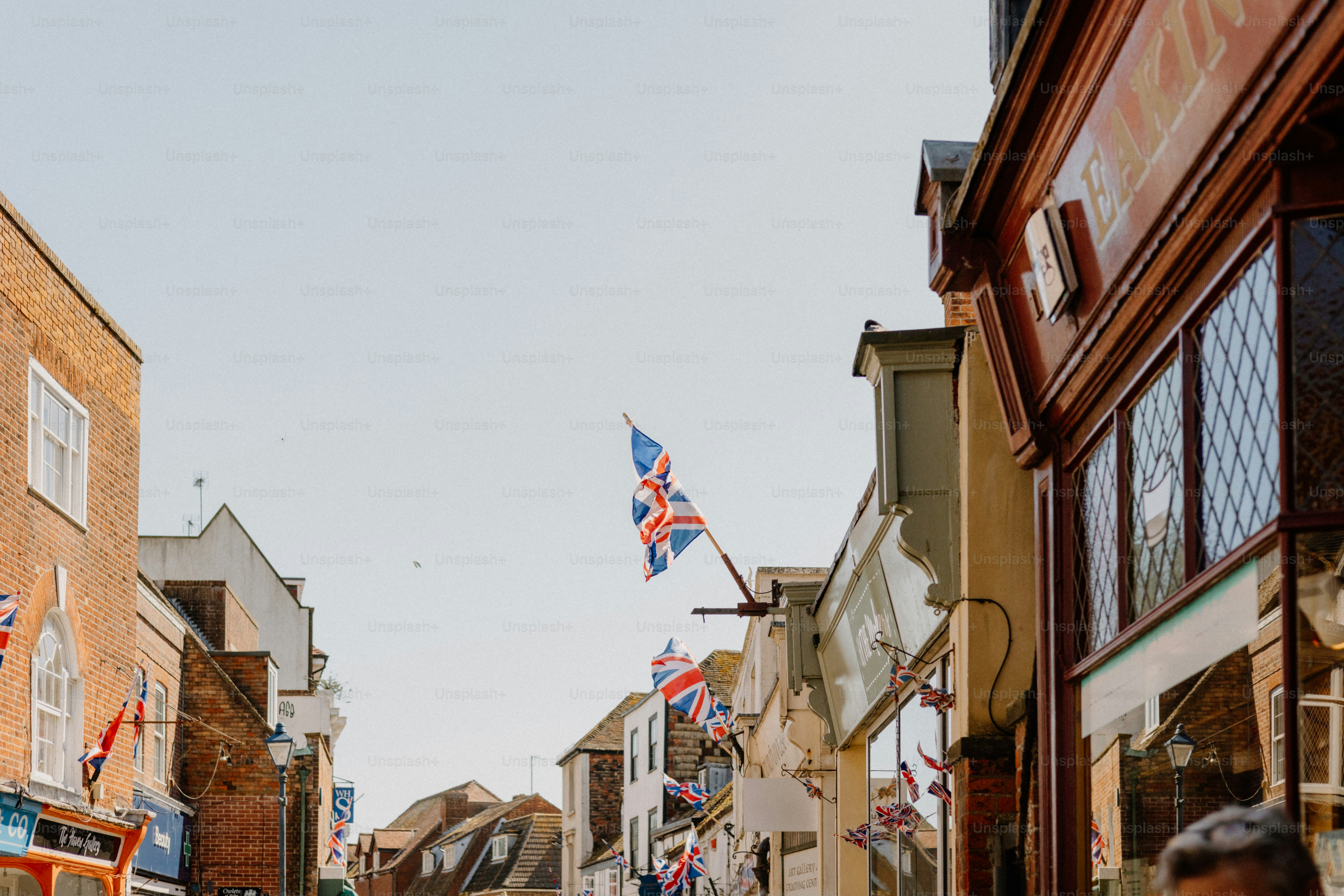 Buildings and union jack flags on a street.