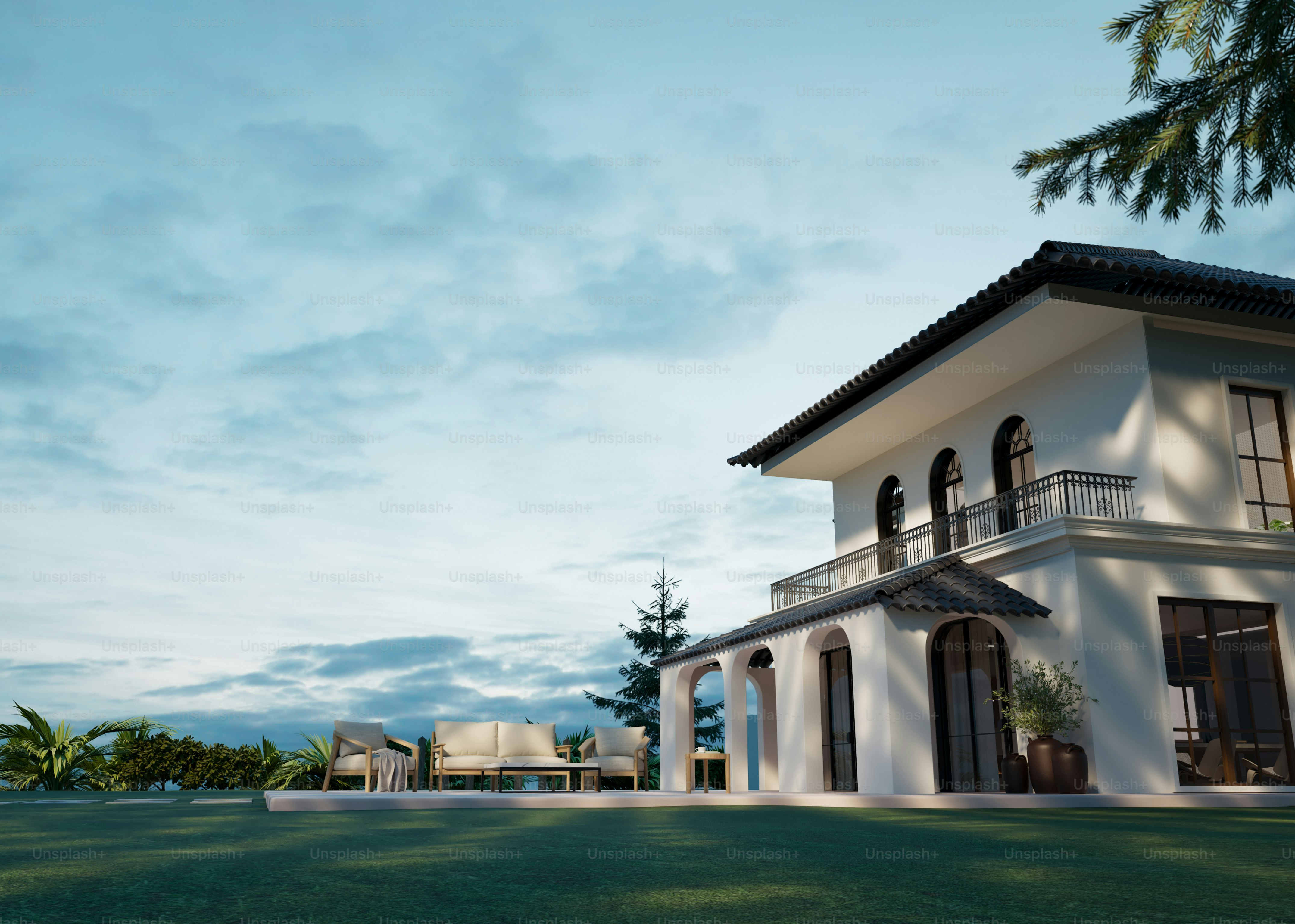 A beautiful house sits on a lovely lawn.