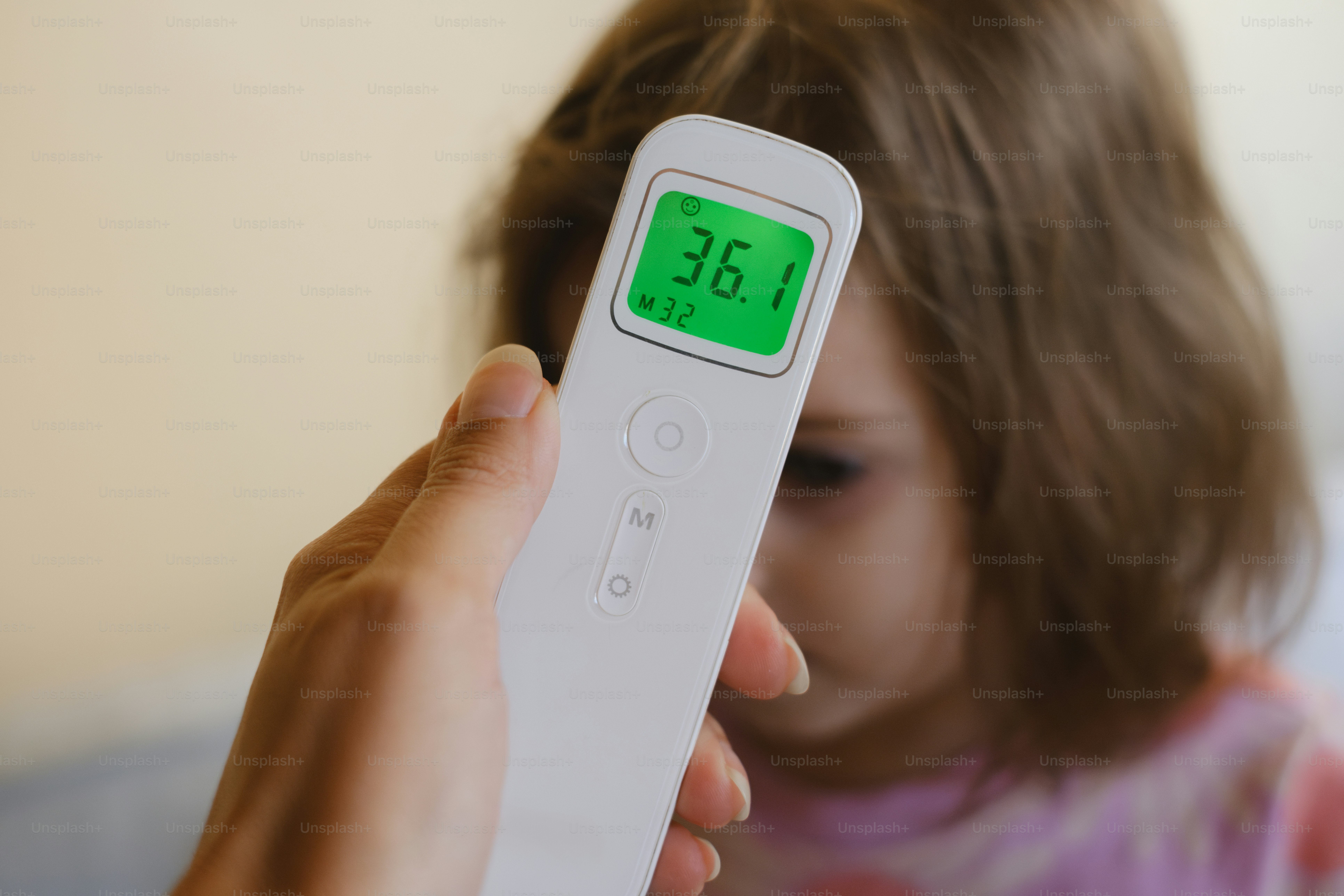 A child's temperature is being taken.