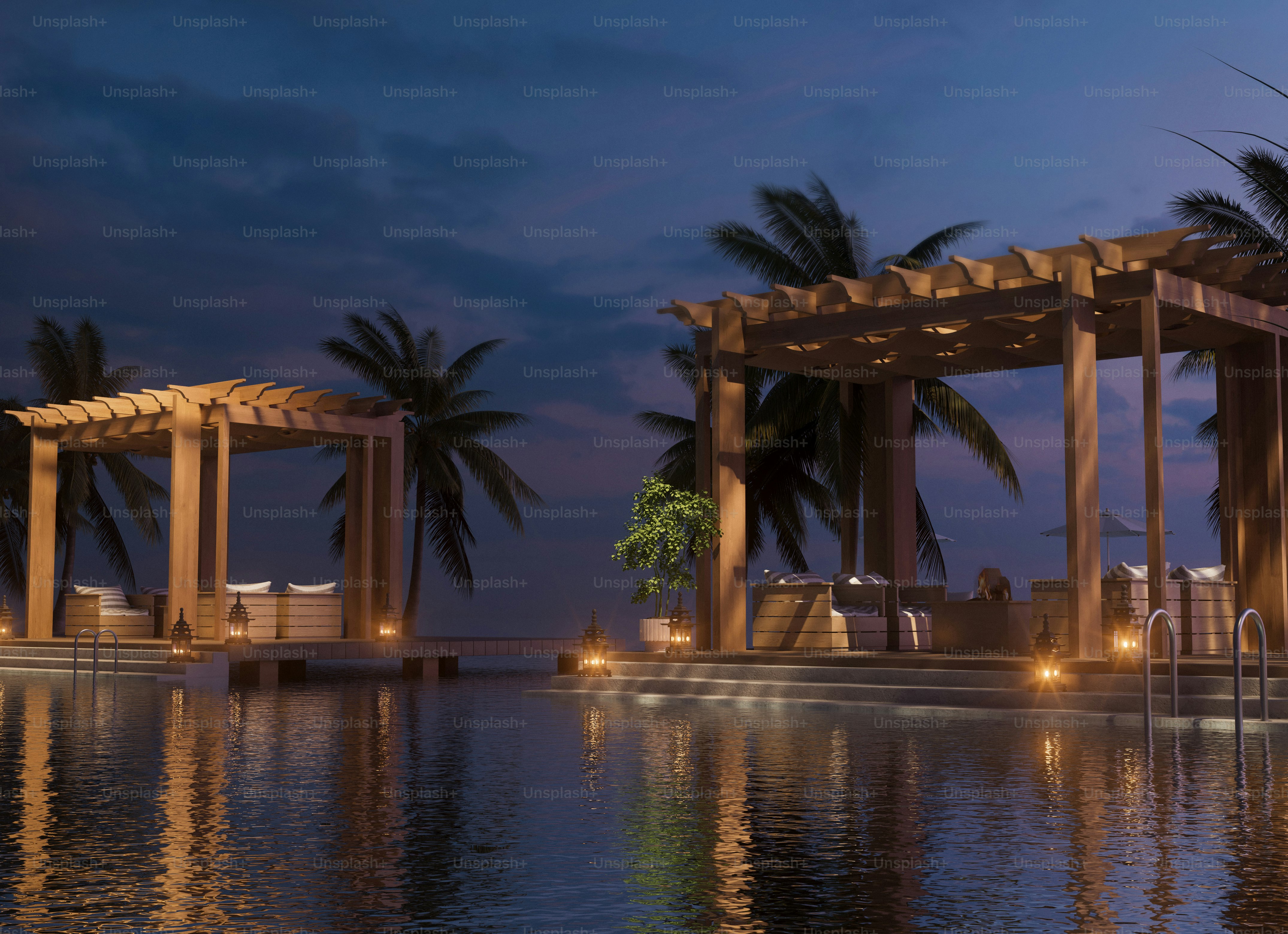 Luxurious resort at night with a pool.