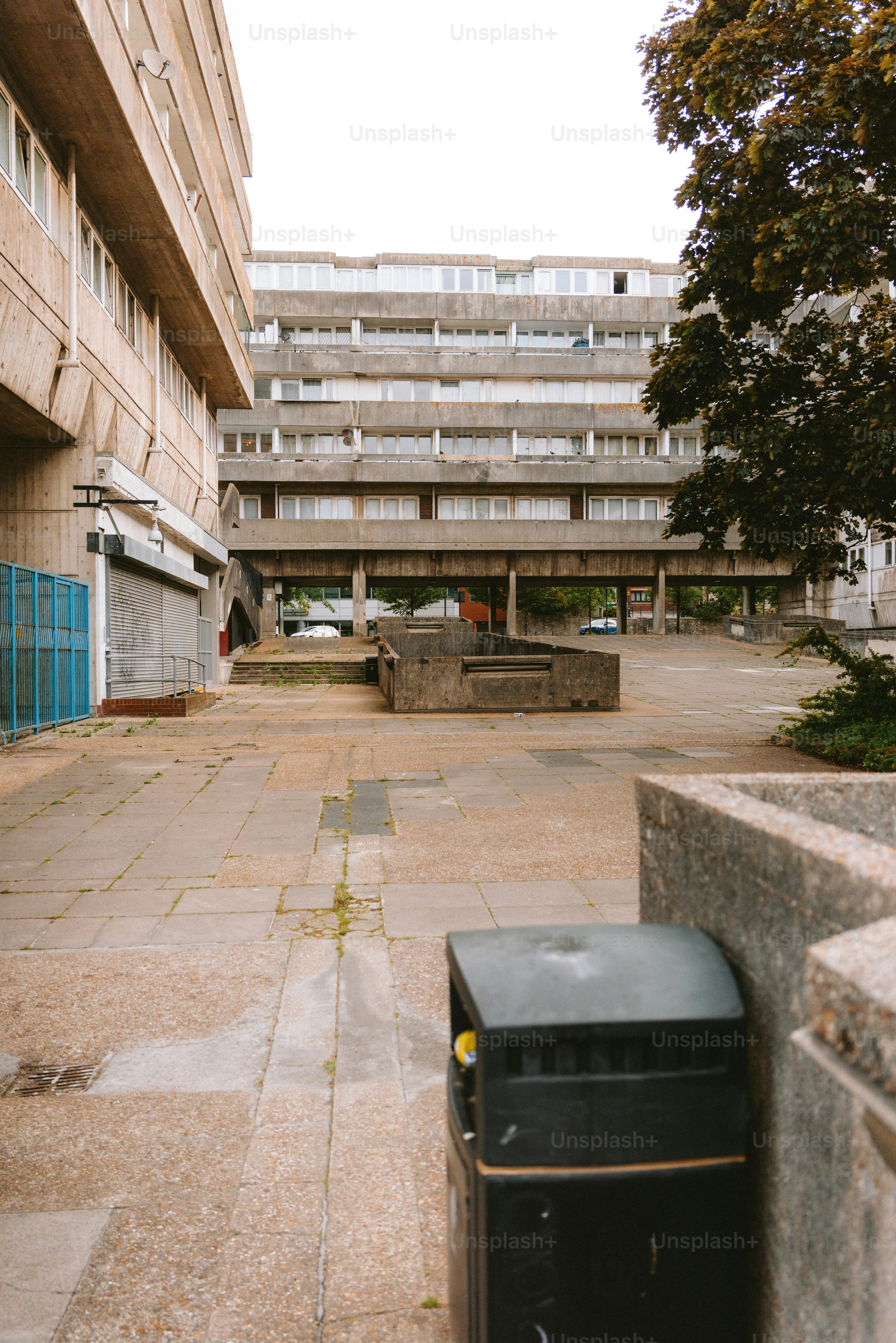 Concrete buildings form a drab urban landscape.