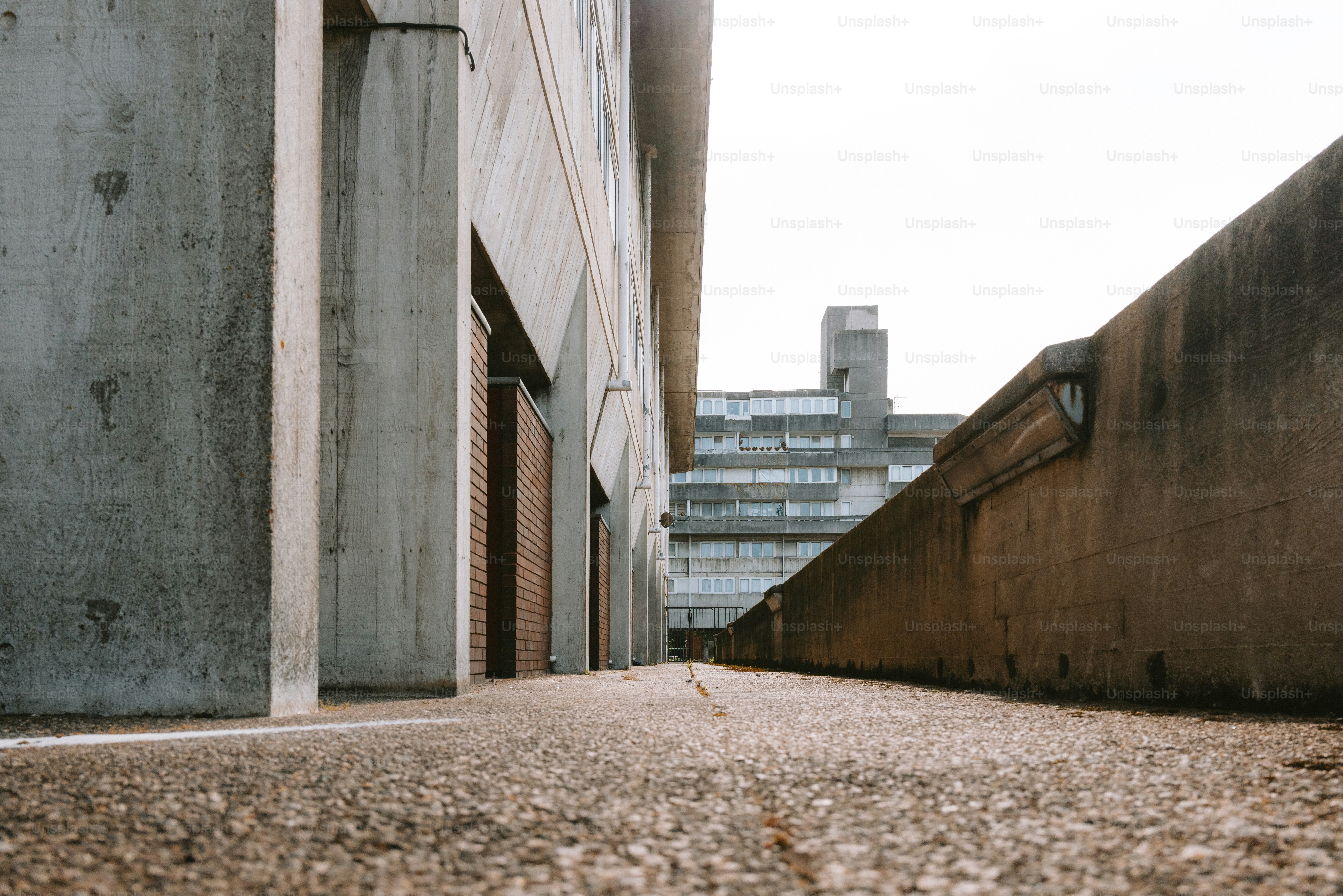 Concrete architecture dominates the shot from a low angle. photo ...