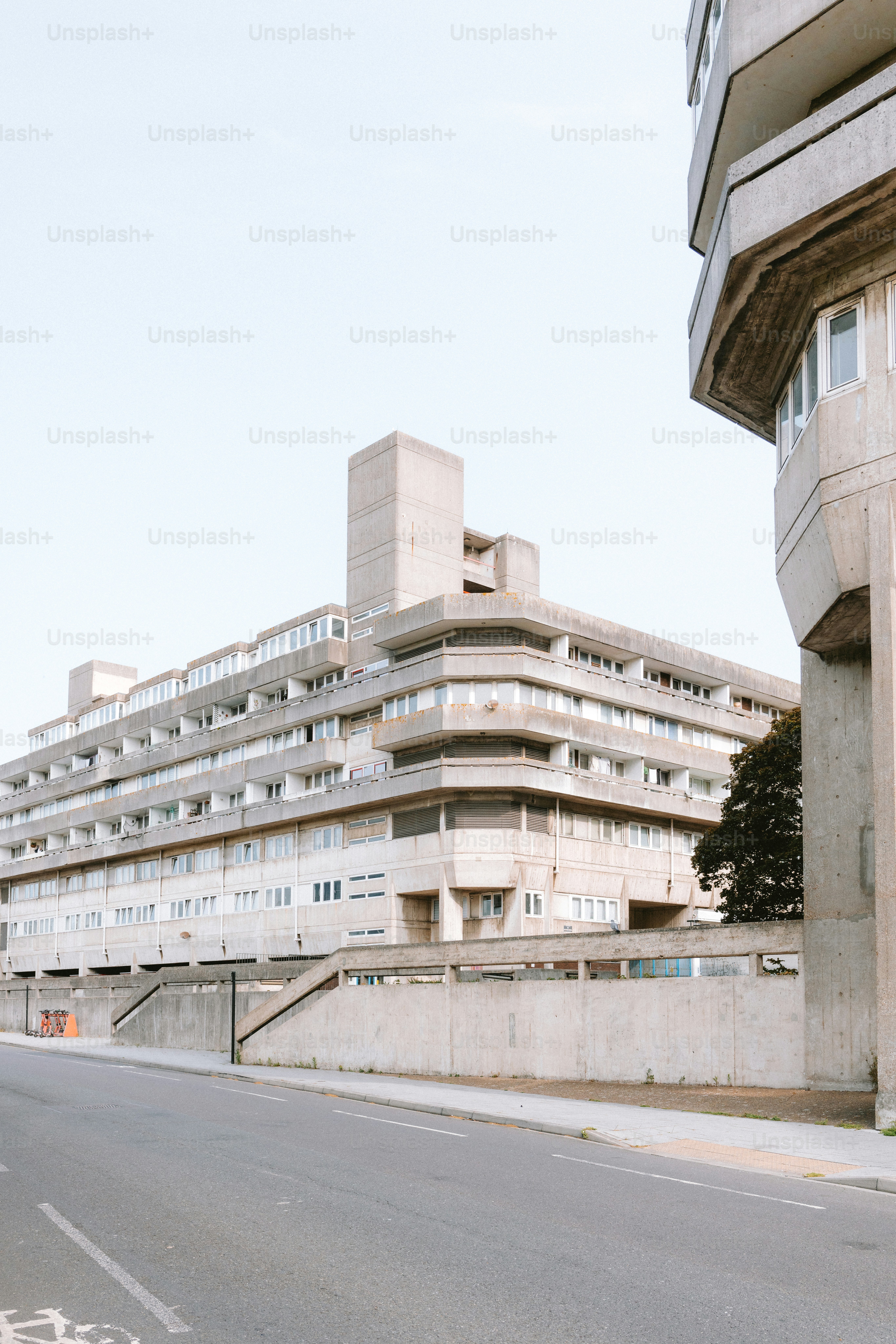 Concrete buildings dominate the sunny, urban landscape.