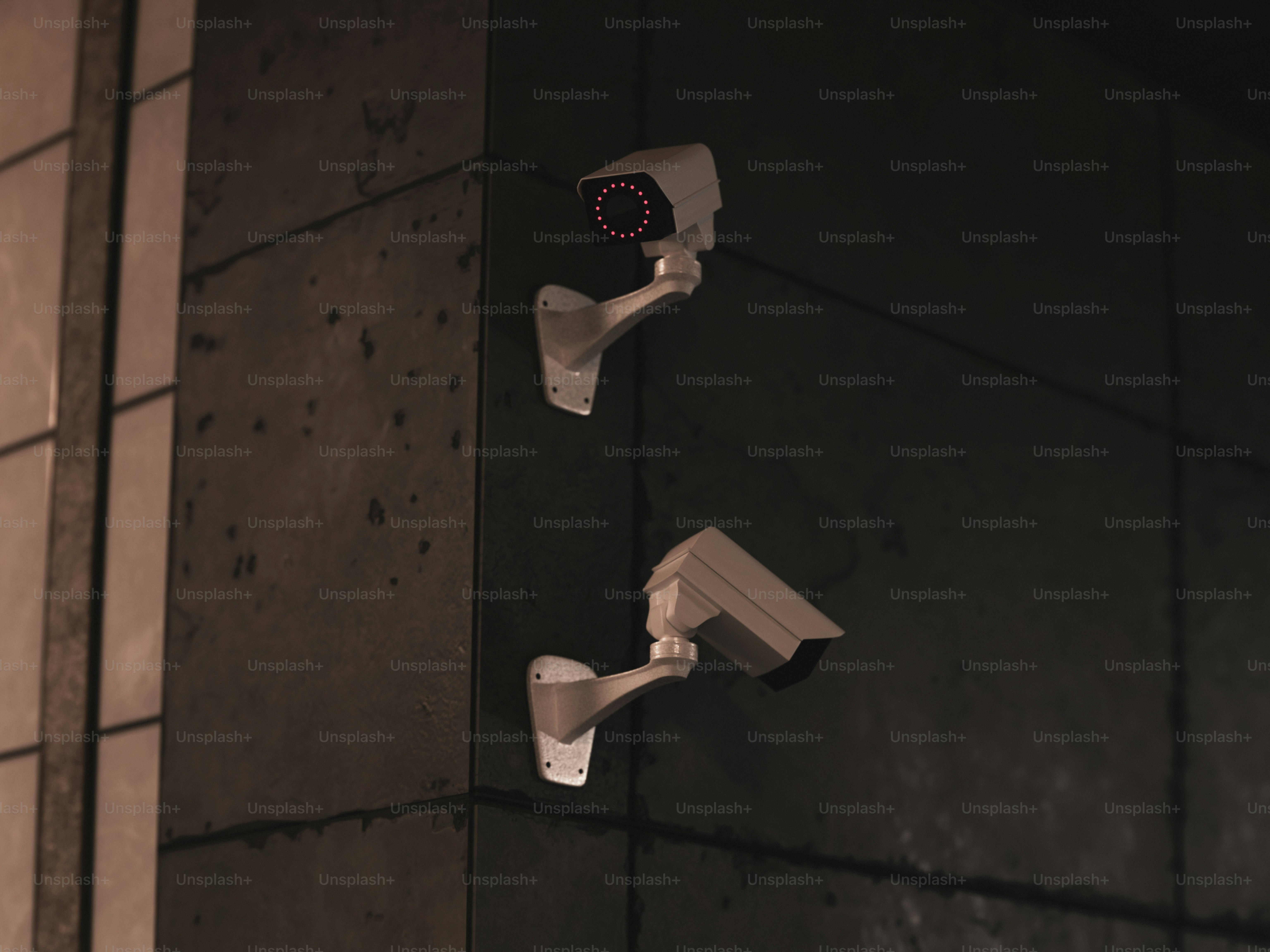 Security cameras are mounted on a building's wall.