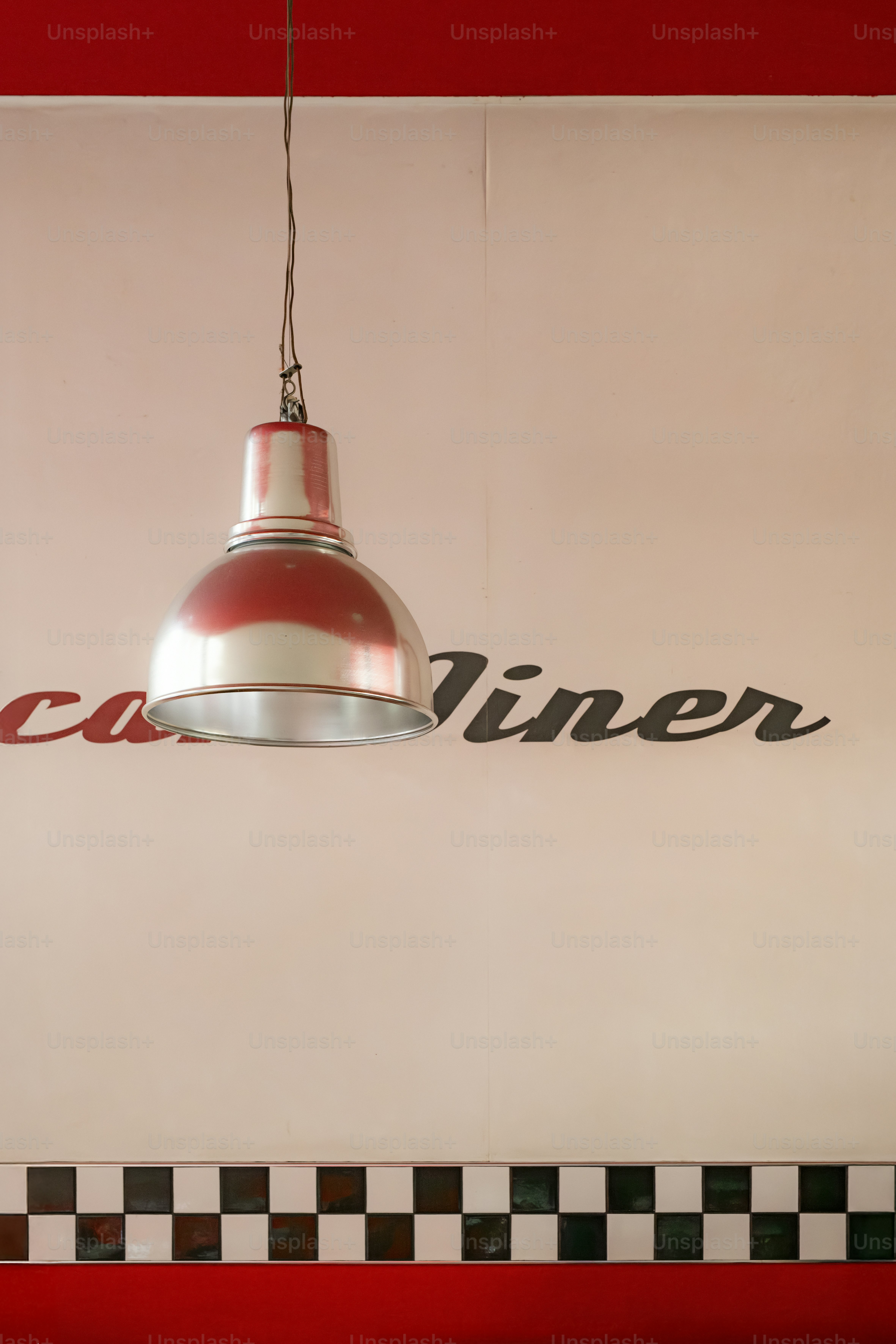 A red and white diner light hangs.