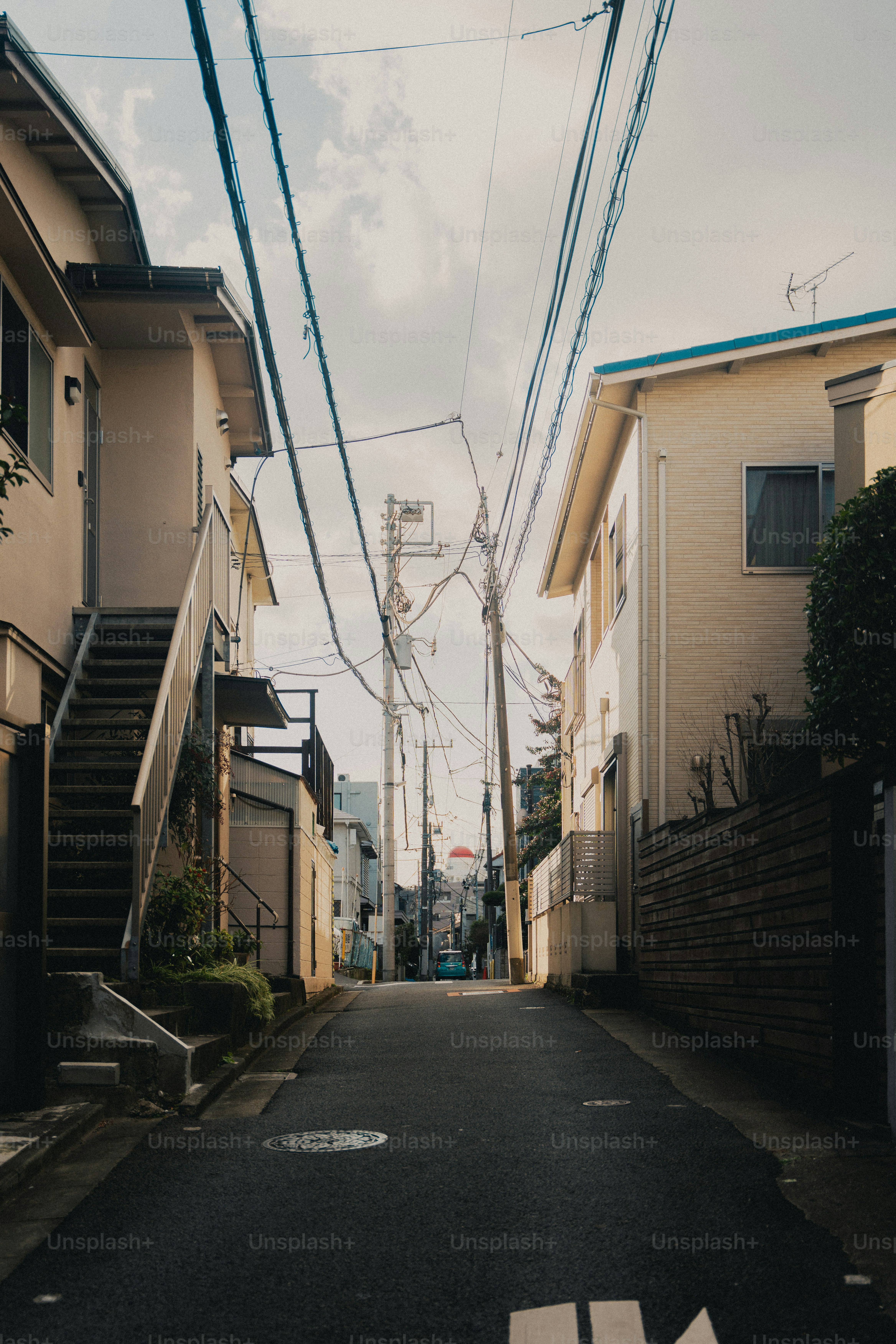 A narrow street in a residential neighborhood.
