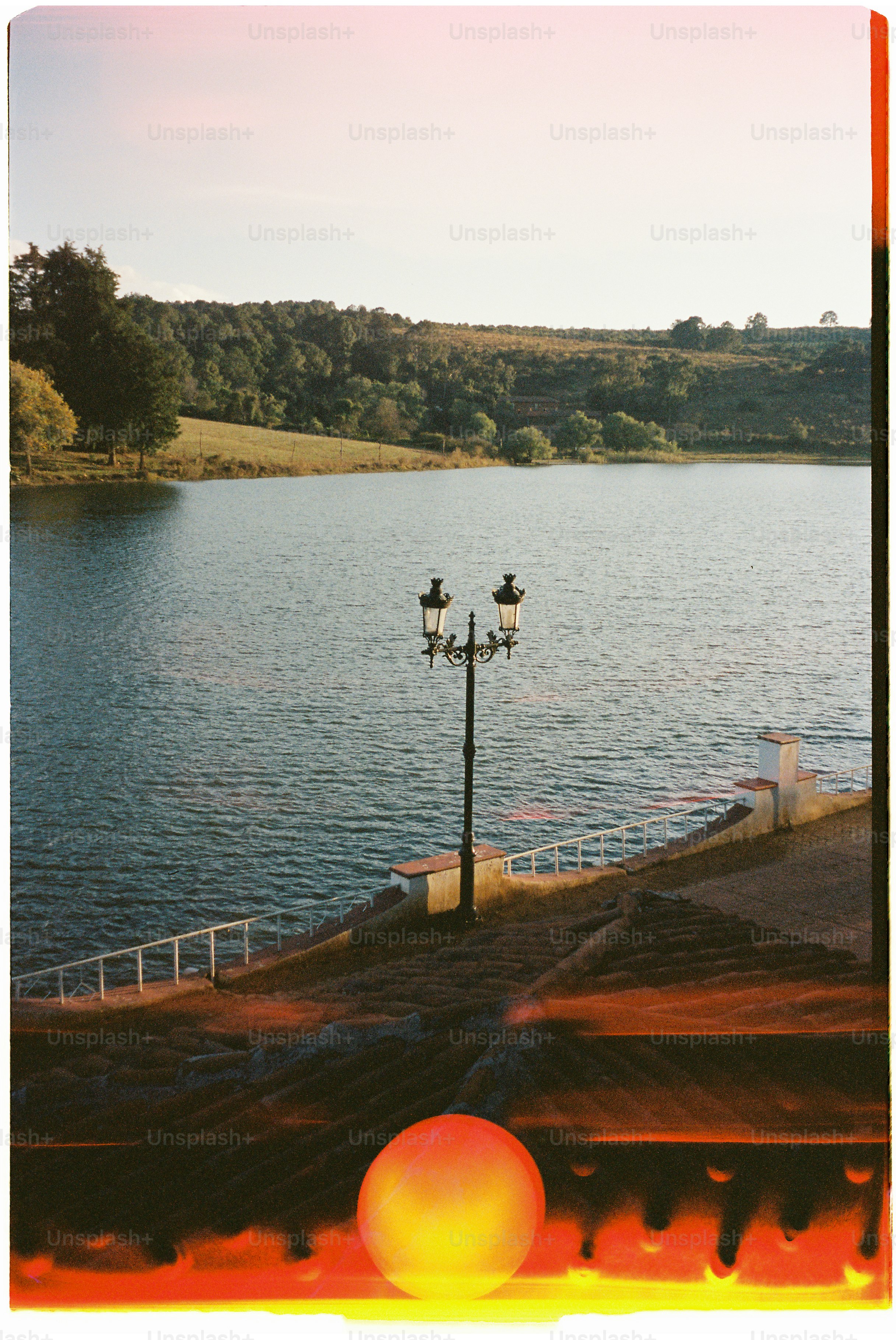 Lake landscape with a lamppost.
