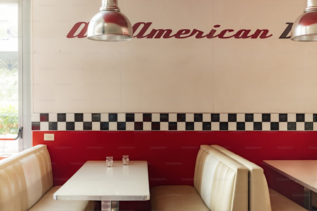 A retro-style american diner booth and tables.
