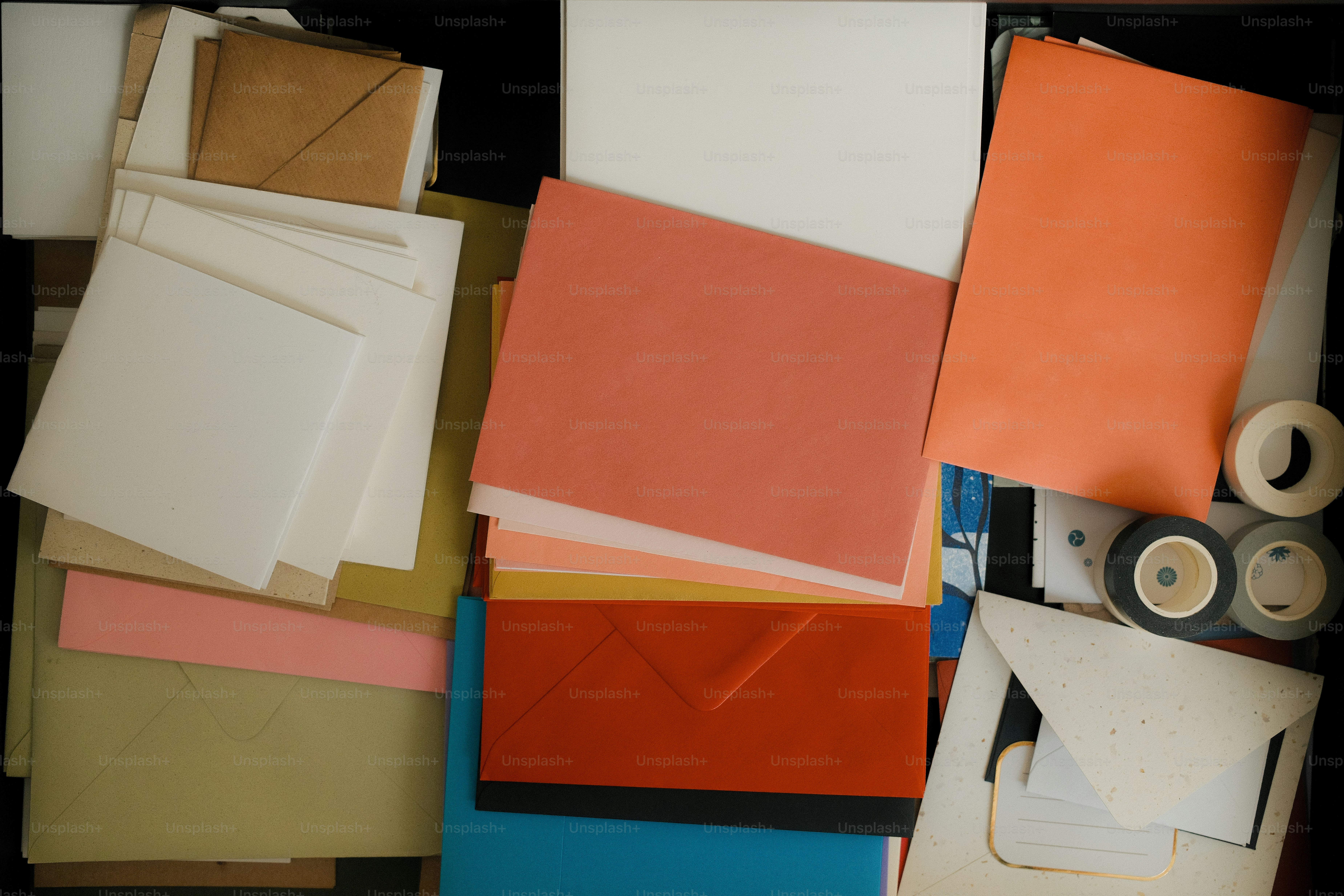 Stationery and envelopes are neatly stored in a drawer.