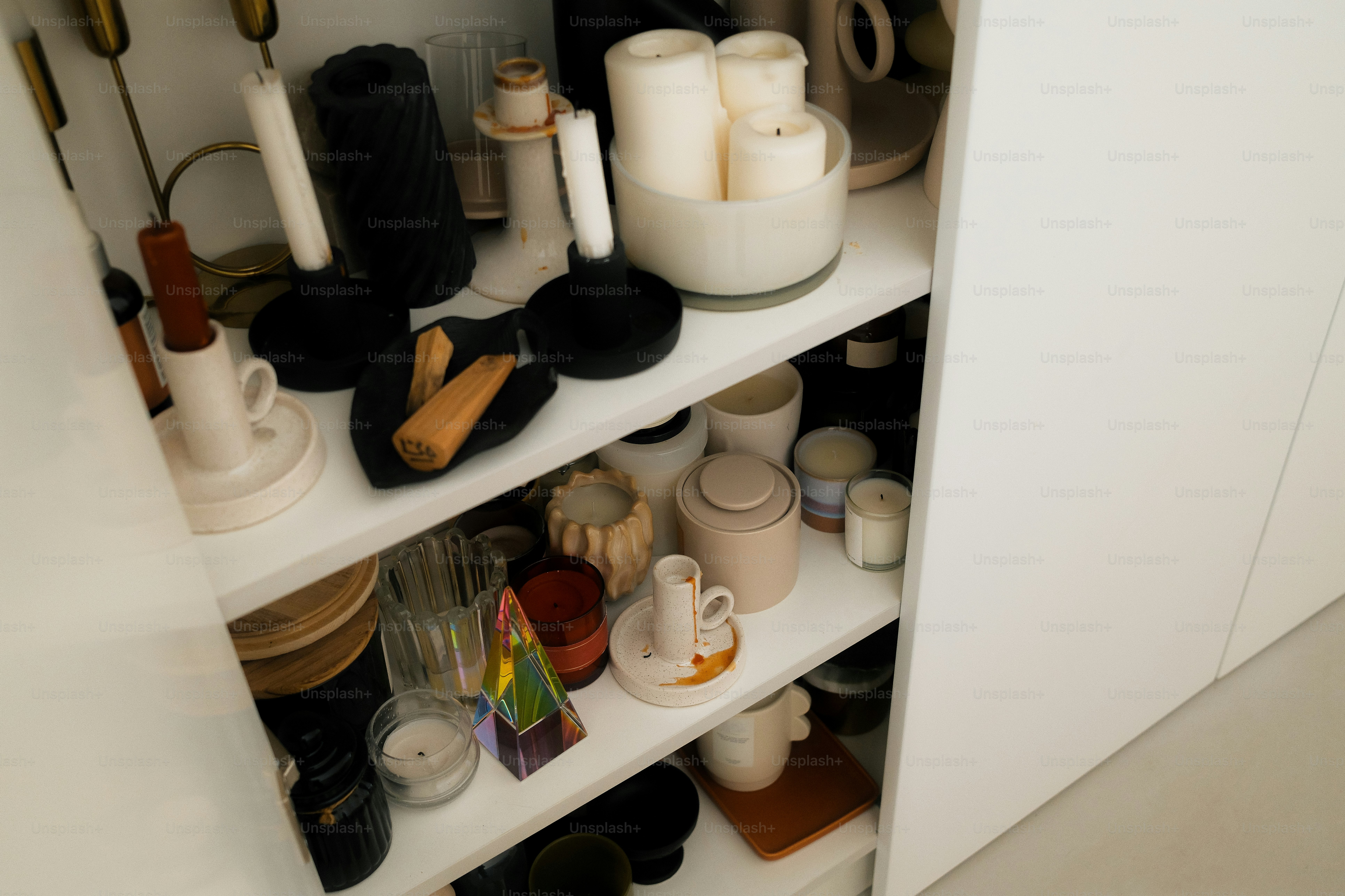 Shelves are packed with candles and various decor.