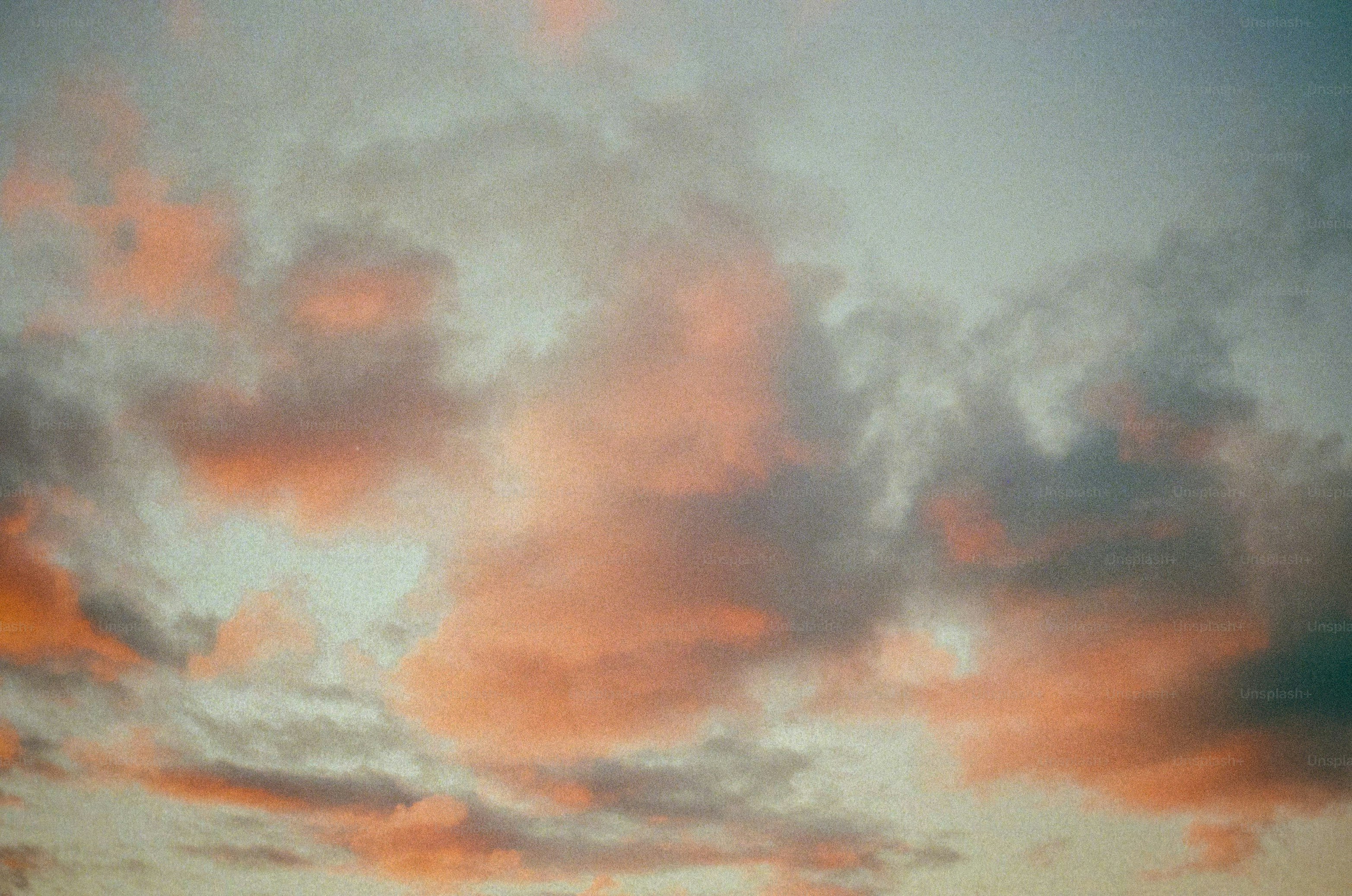 Sunset clouds display gorgeous shades of pink and grey.