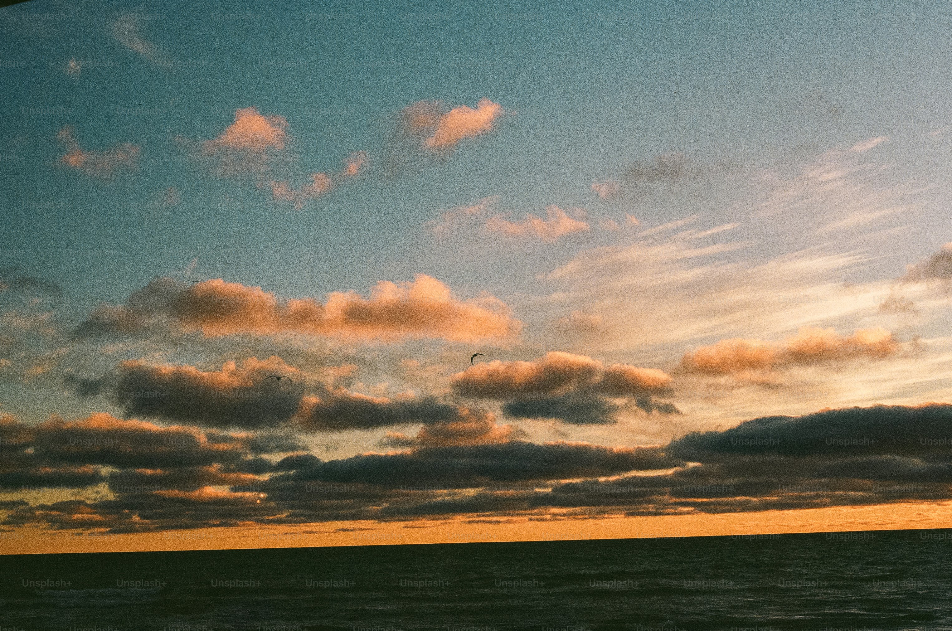Beautiful sunset with clouds over the ocean.