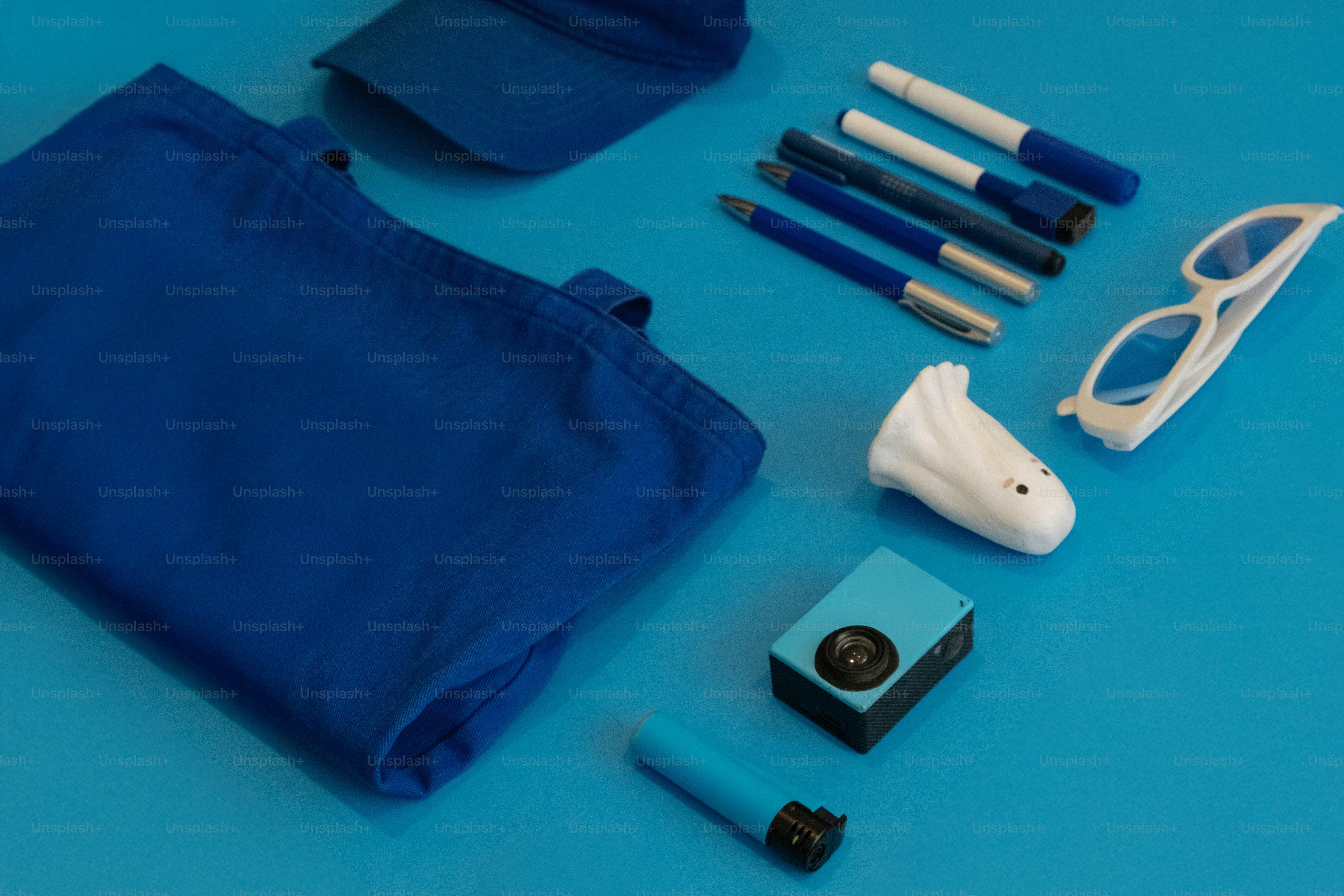 Blue accessories are arranged on a blue background.