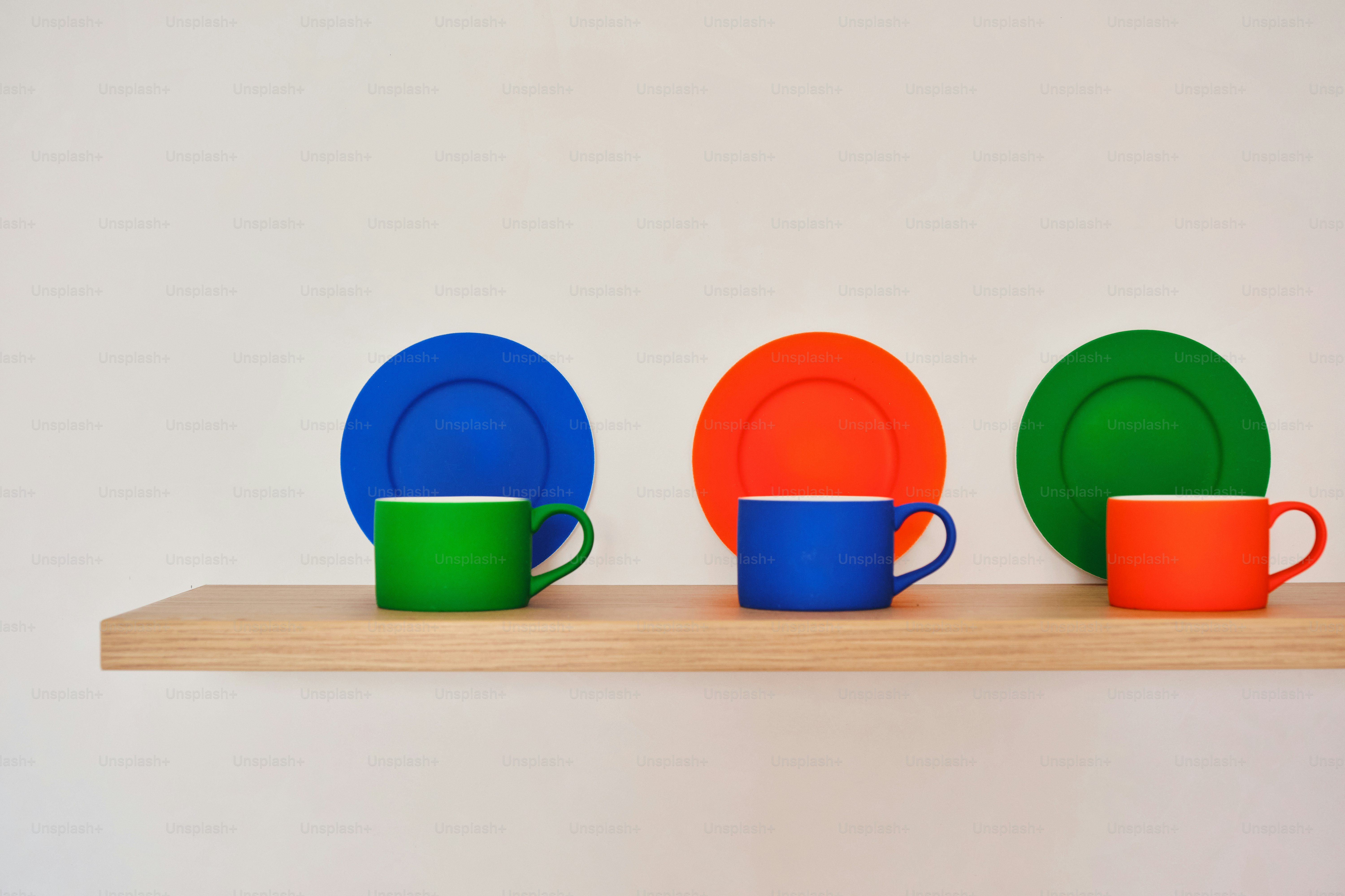 Plates and cups are organized in a colorful row.