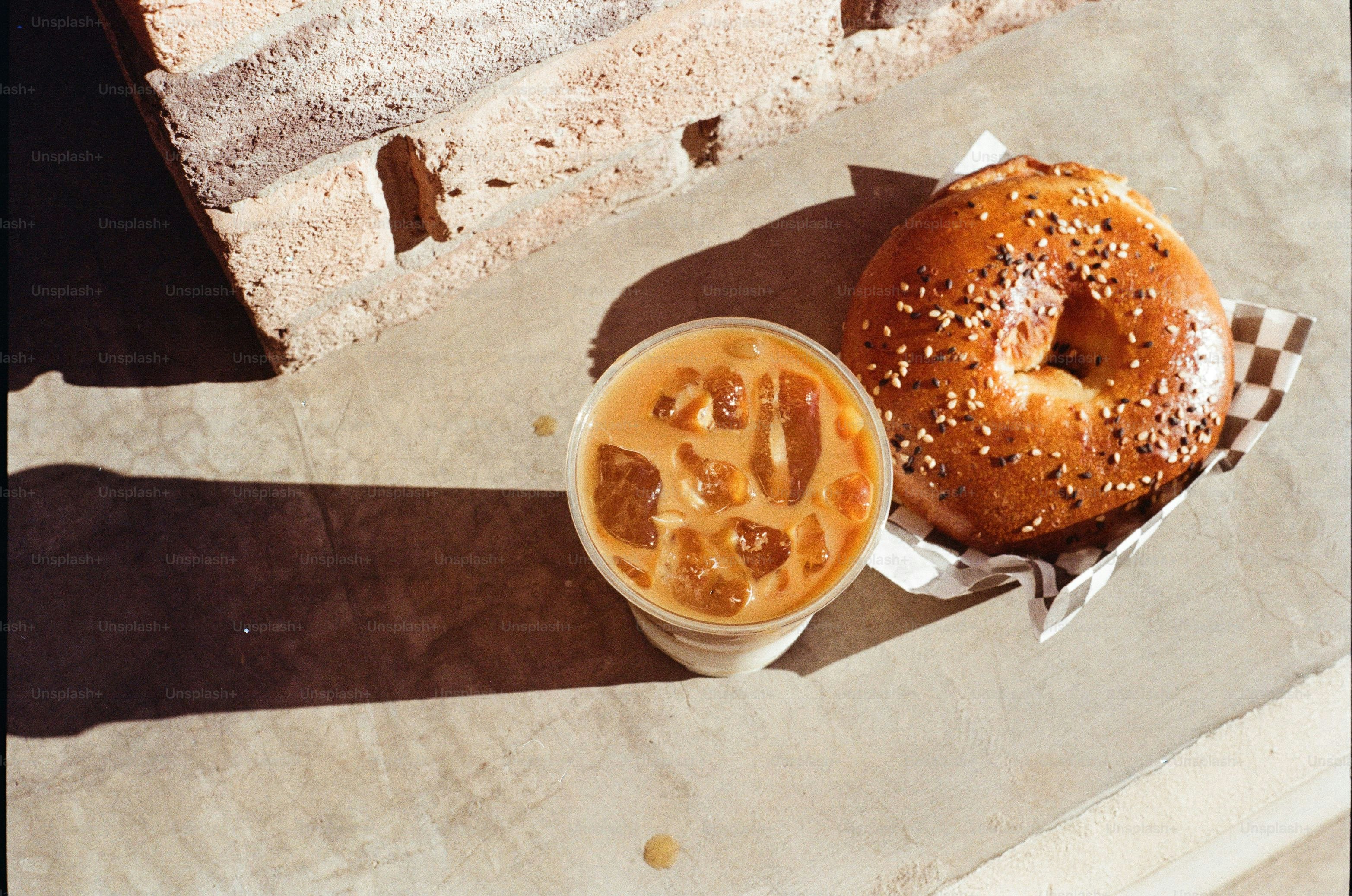Bagel and iced coffee on a table