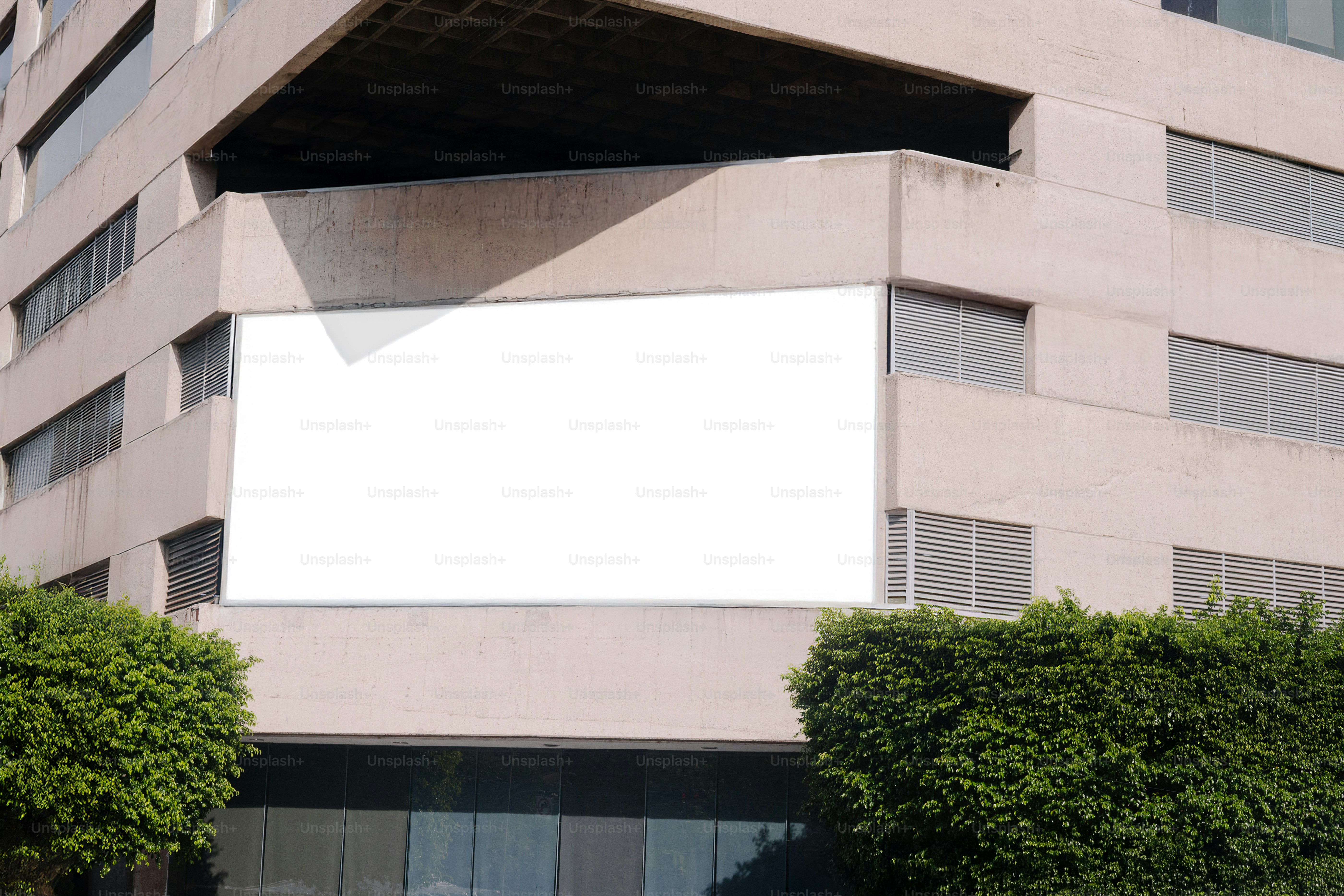 A blank billboard is on the side of the building.